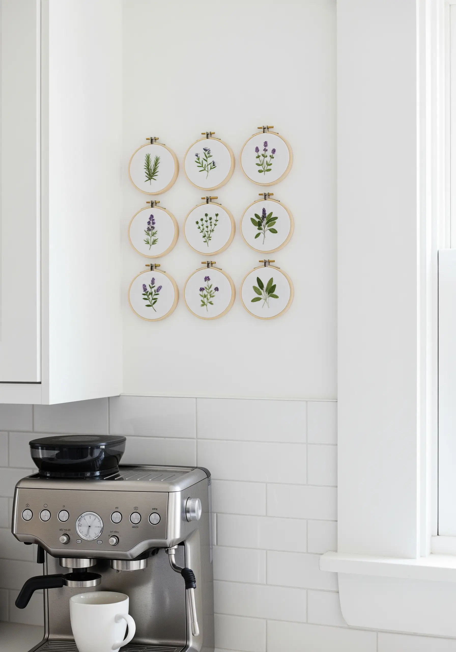A 3x3 grid of small embroidery hoops, each featuring a different culinary herb.