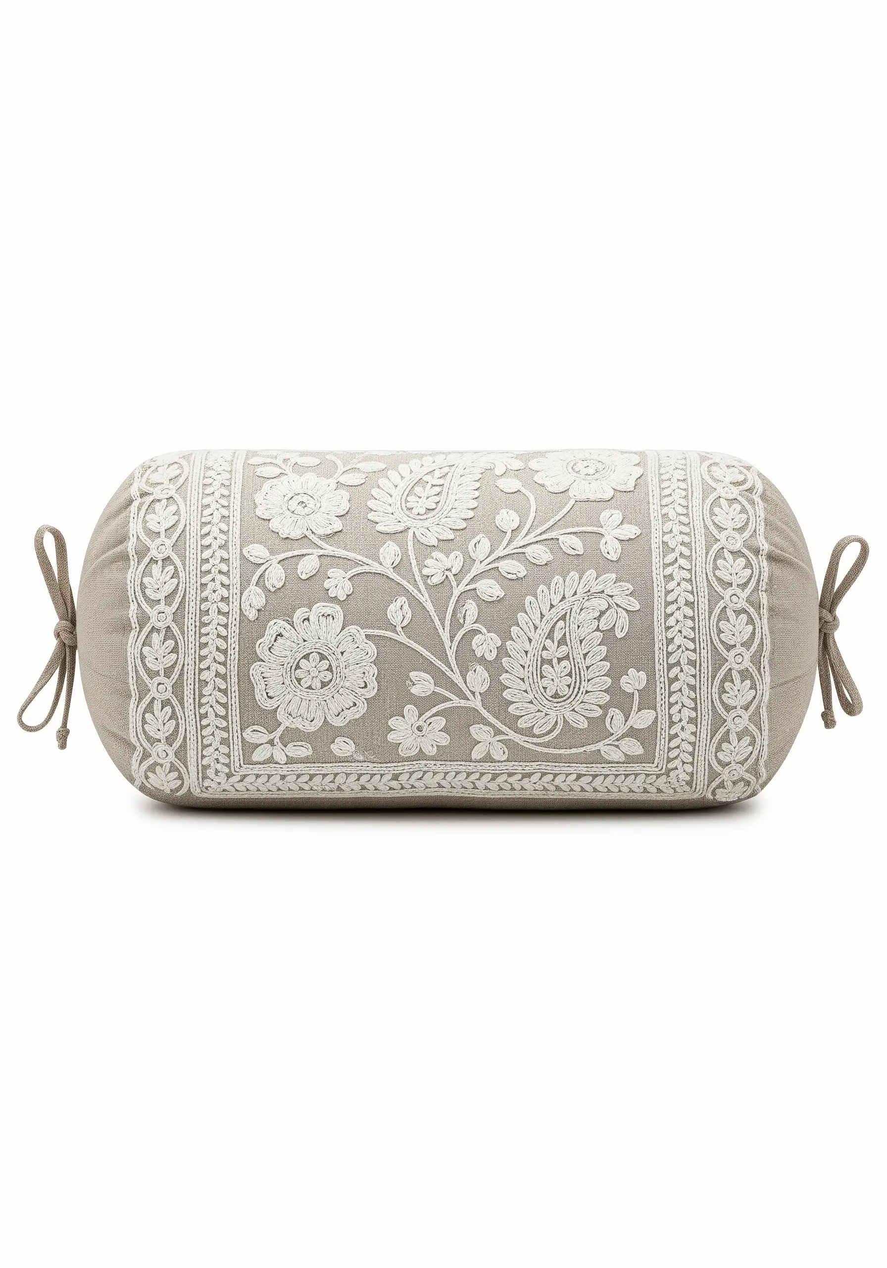 White-on-white Chikankari-style floral and paisley embroidery on a linen bolster