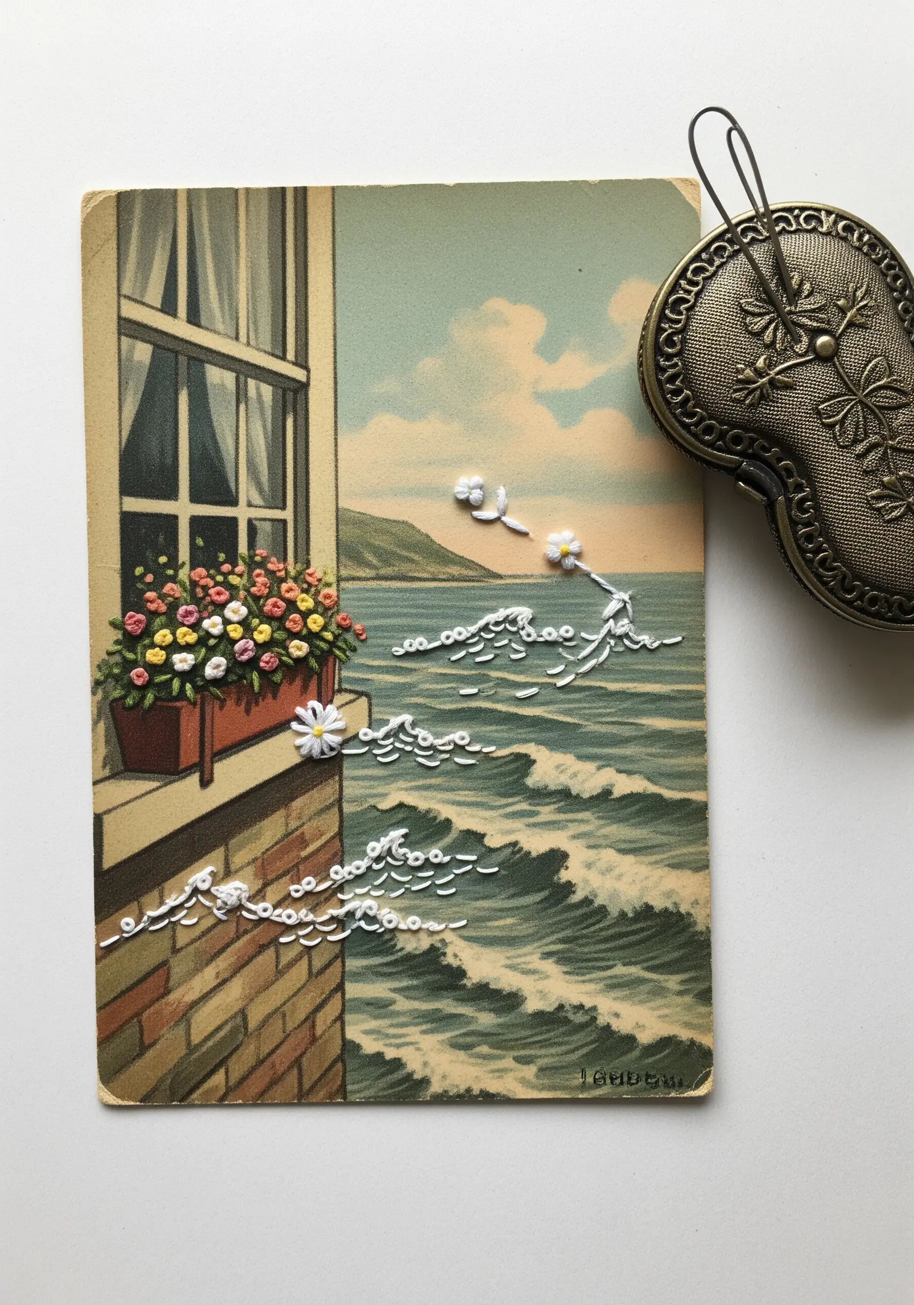 A vintage postcard of a sea view with white embroidery added to create whimsical waves and flowers.