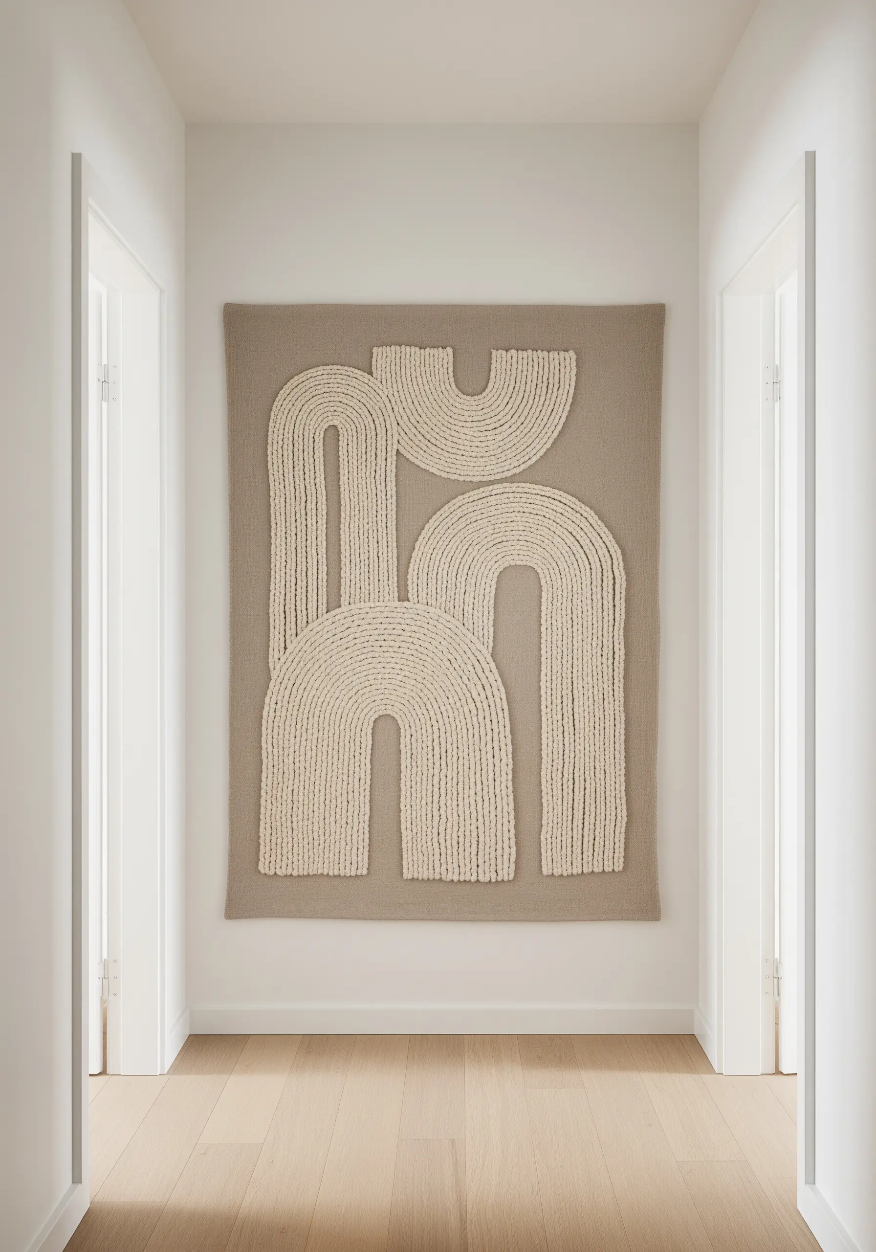 Large-scale wall art featuring thick macrame cord couched into abstract arch shapes.