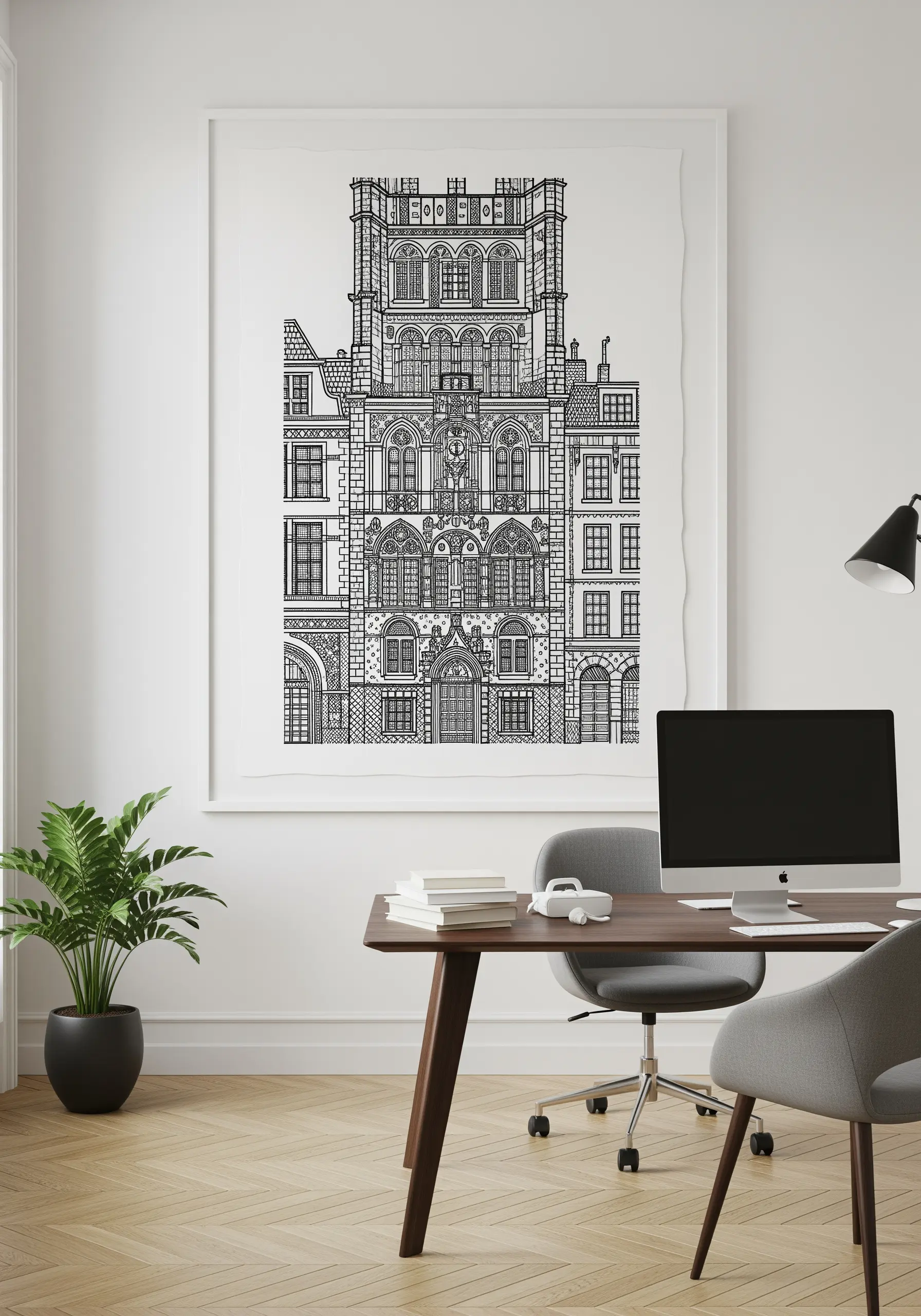 A large, framed blackwork embroidery of a detailed architectural facade in an office.
