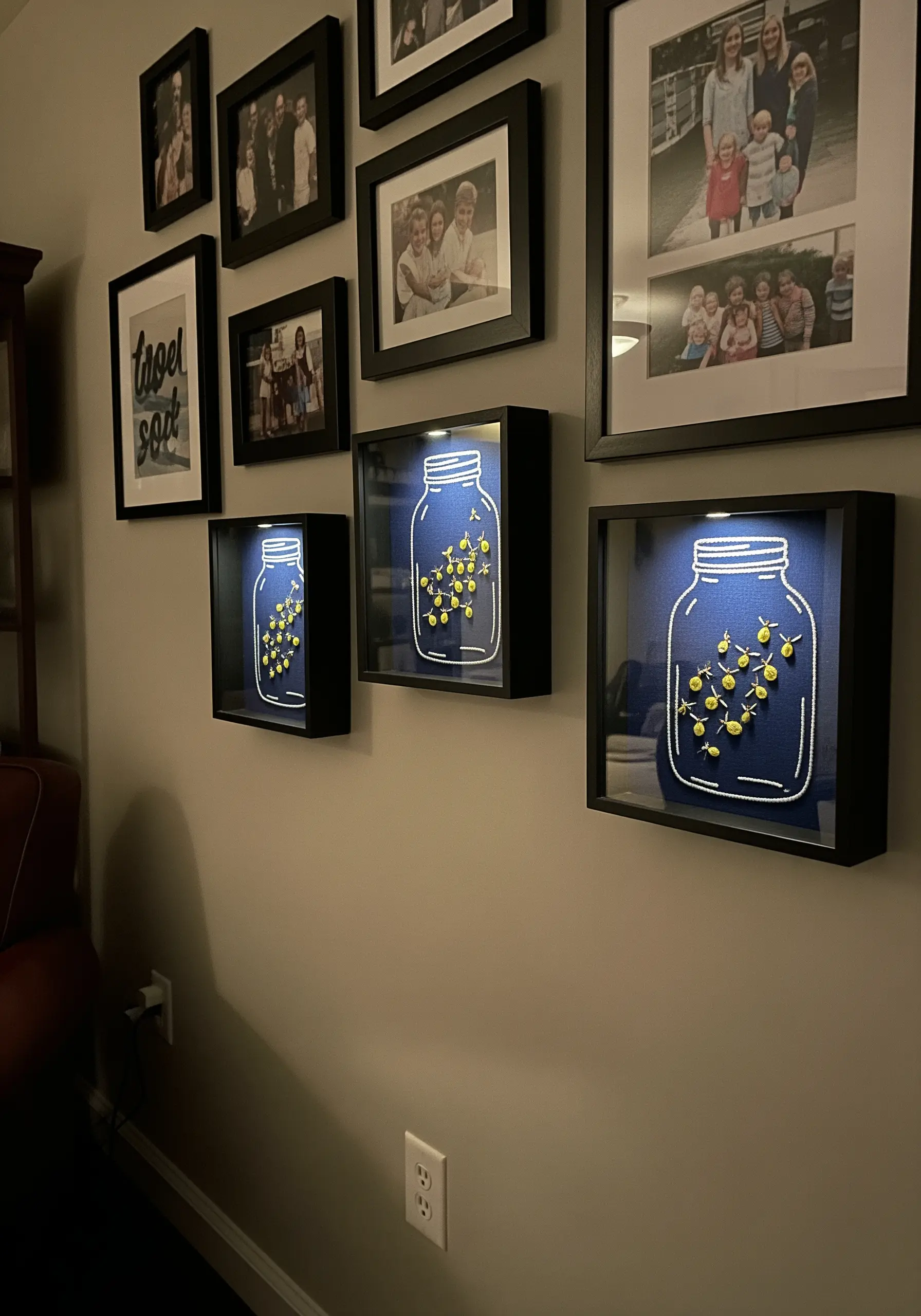 Three shadowbox frames with embroidered fireflies in a jar, stitched with metallic thread.