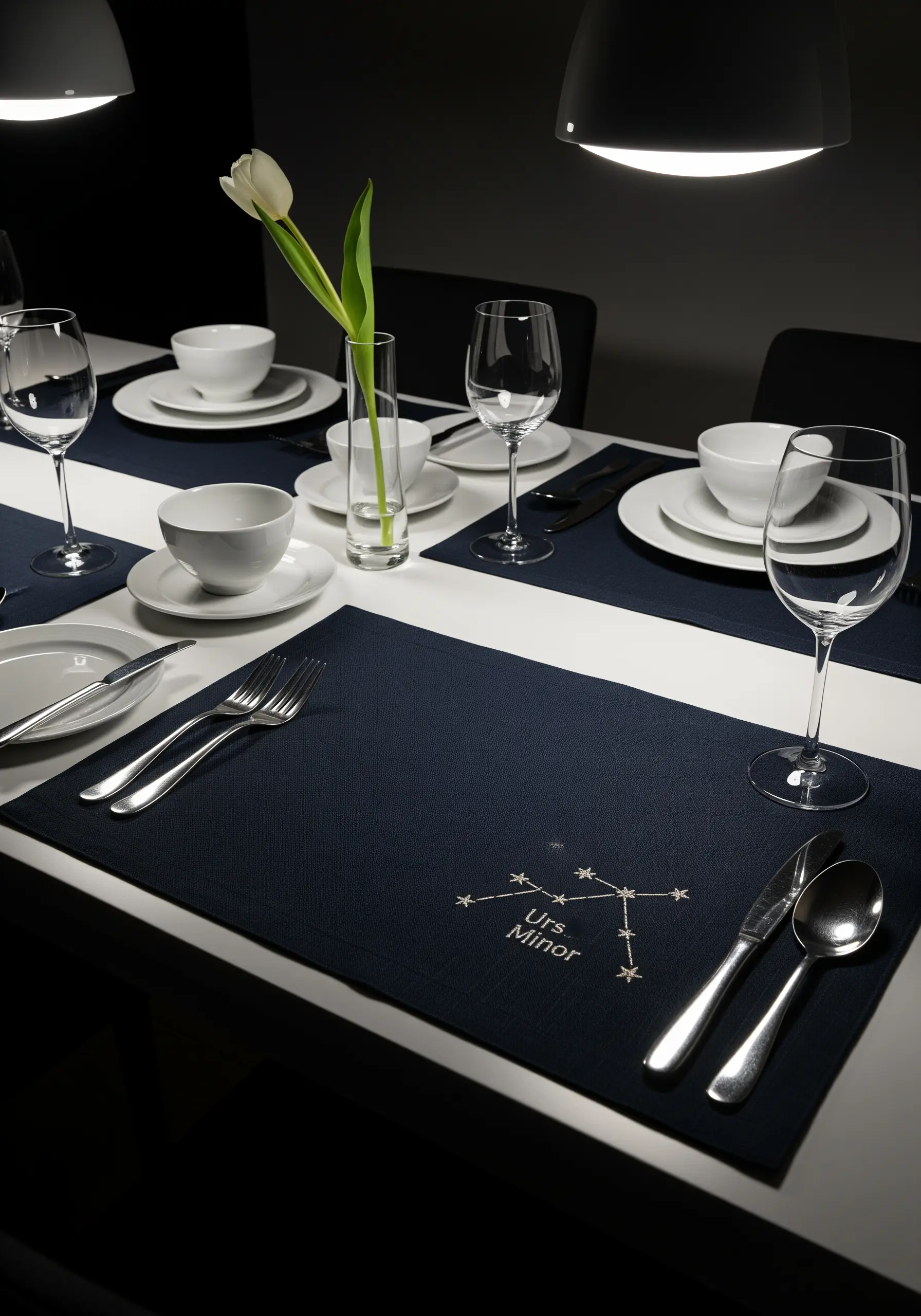 The Ursa Minor constellation embroidered in white thread on a dark blue placemat.