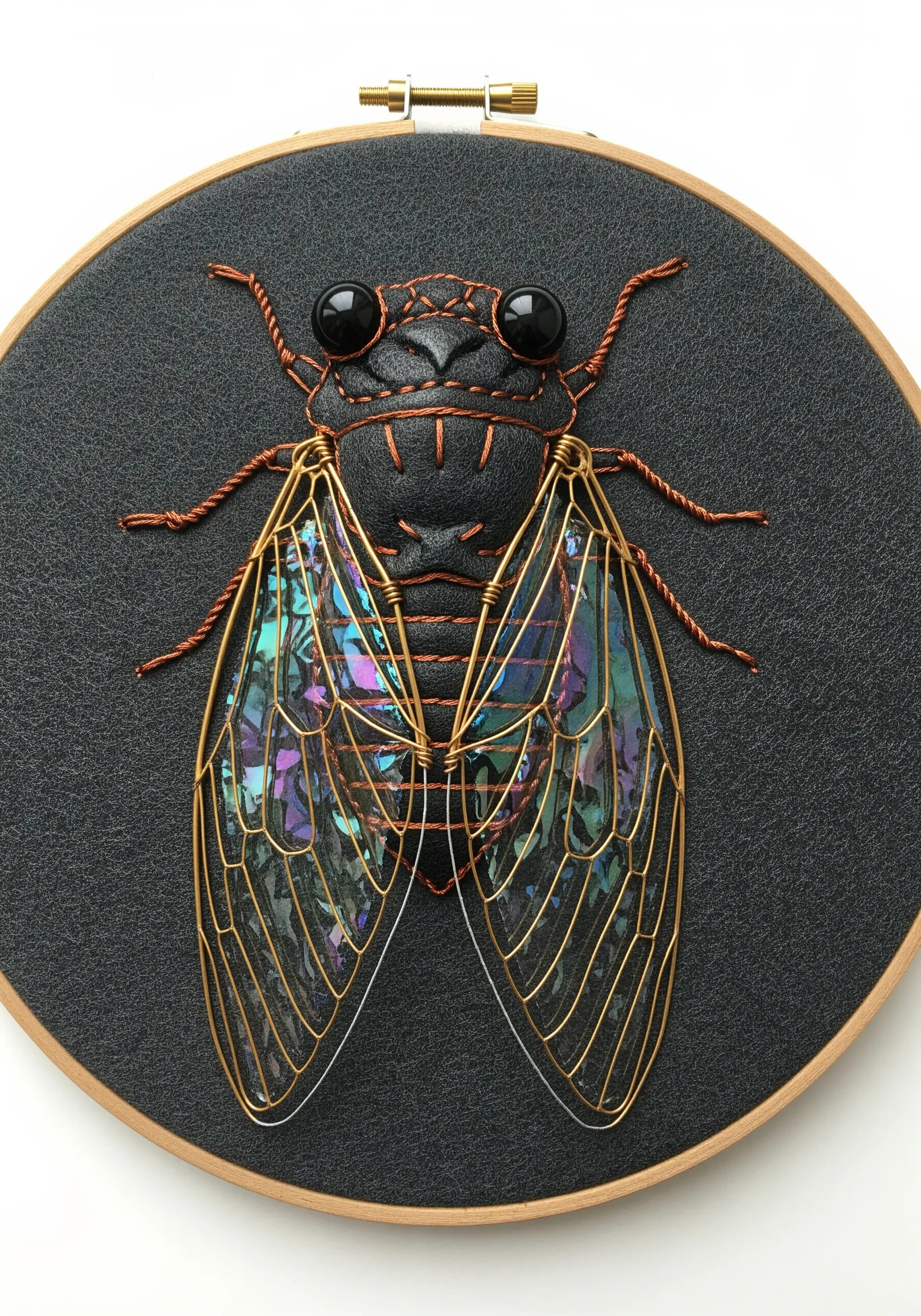 Mixed-media cicada with a faux leather body, wire-framed iridescent cellophane wings.