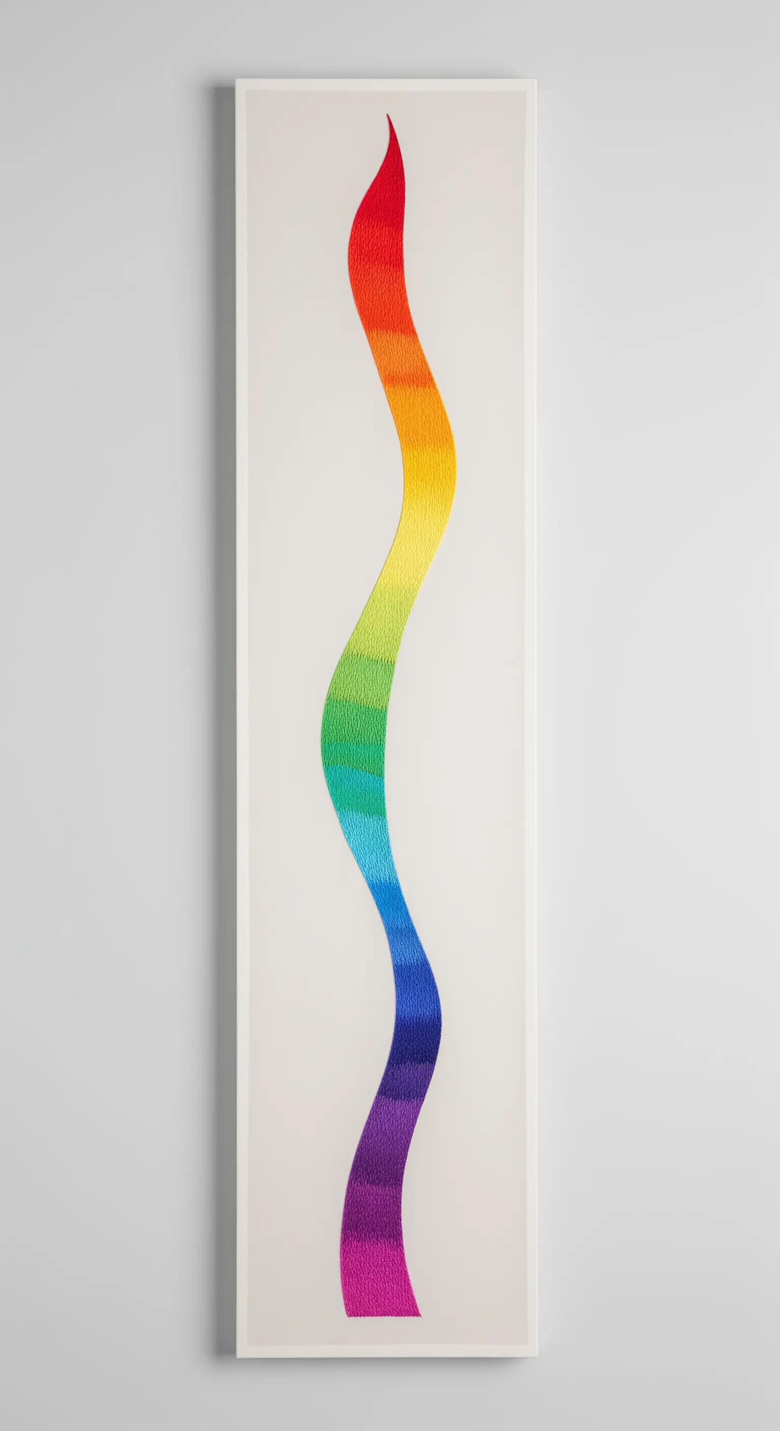 A long, vertical canvas with a single, flowing embroidered rainbow wave.