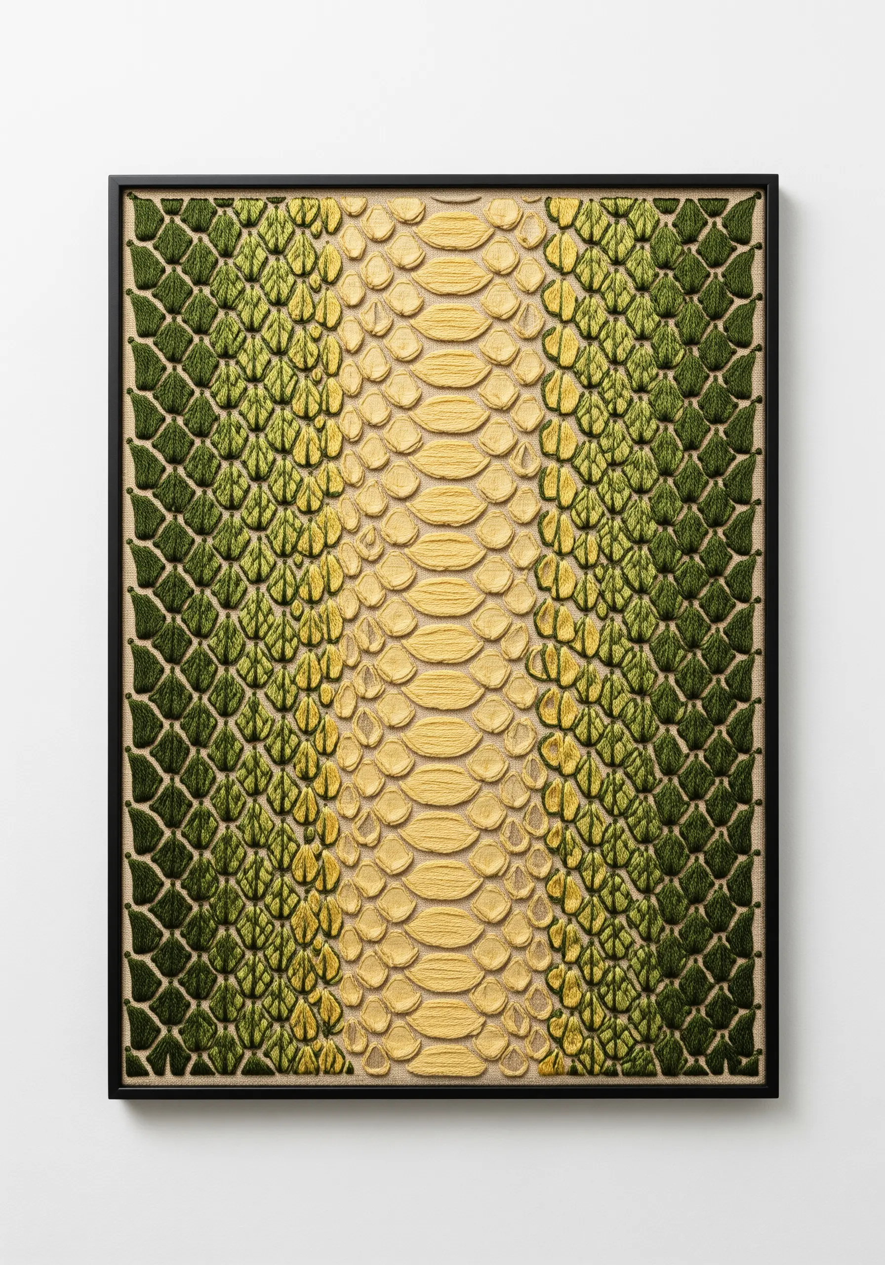 A framed embroidery piece showing realistic snake scales in green and yellow.