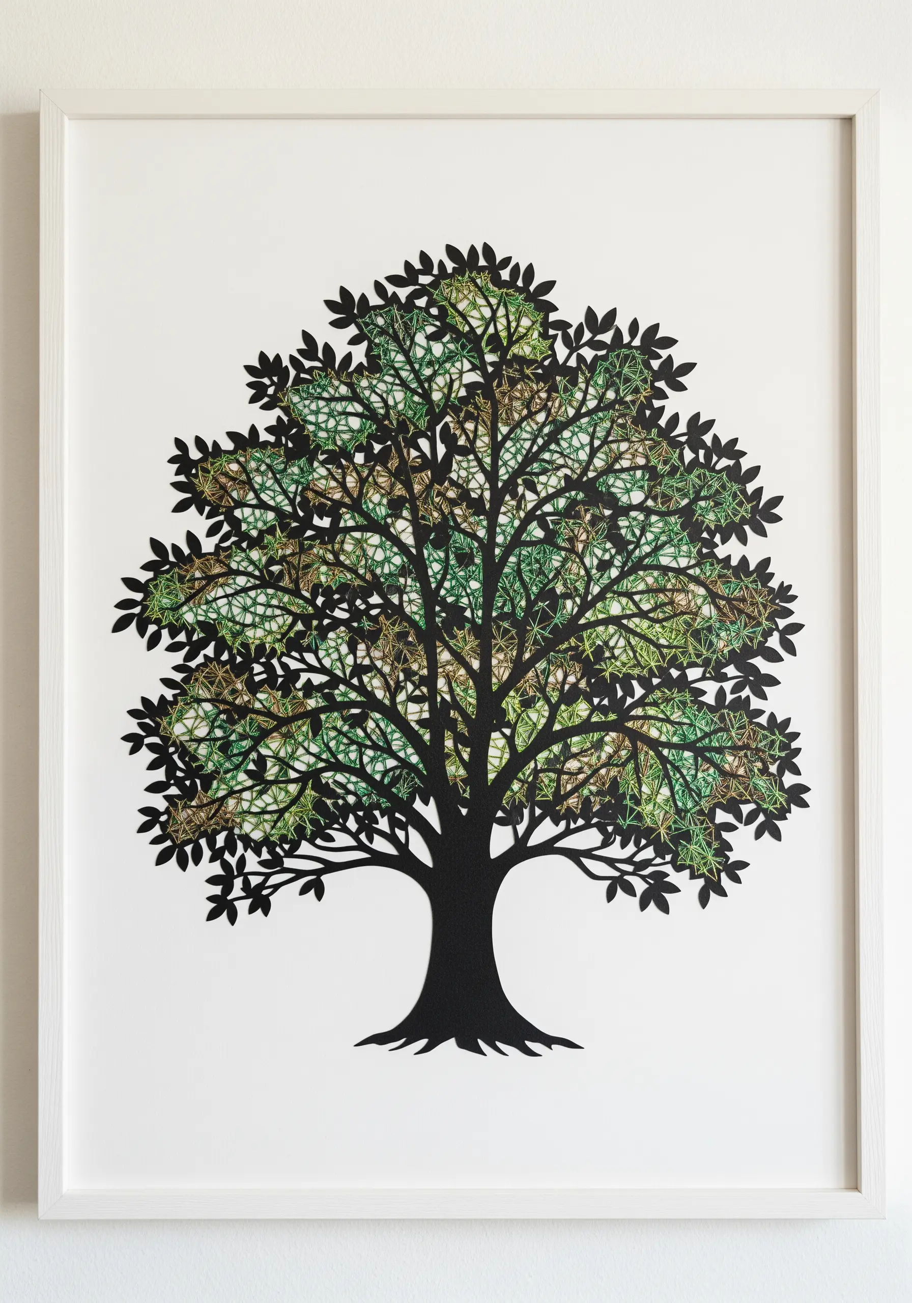 A large paper cutout of a tree, with the canopy filled in with green and brown string art.