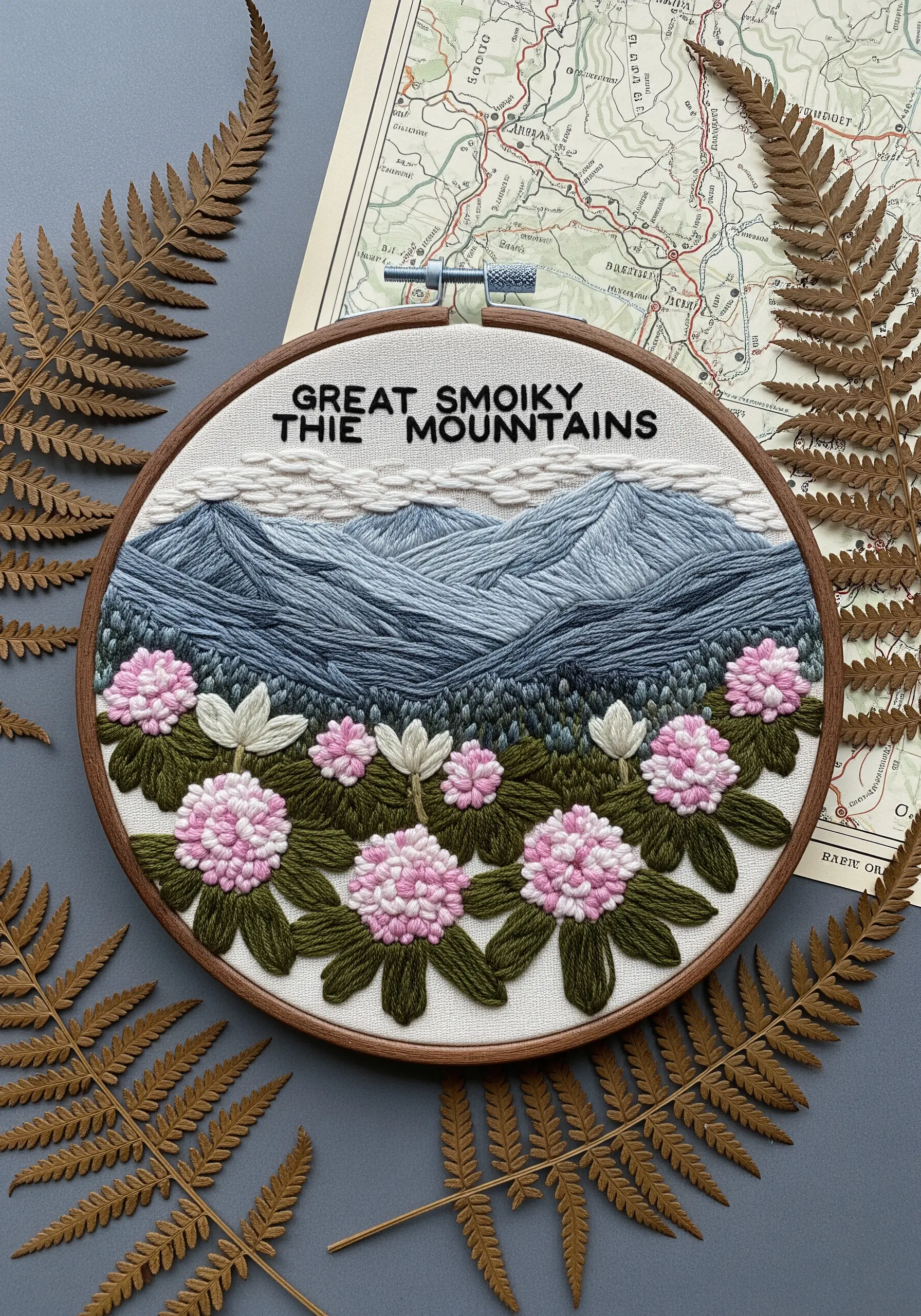 Embroidery of the Great Smoky Mountains with textured foreground flowers and hazy, layered peaks.