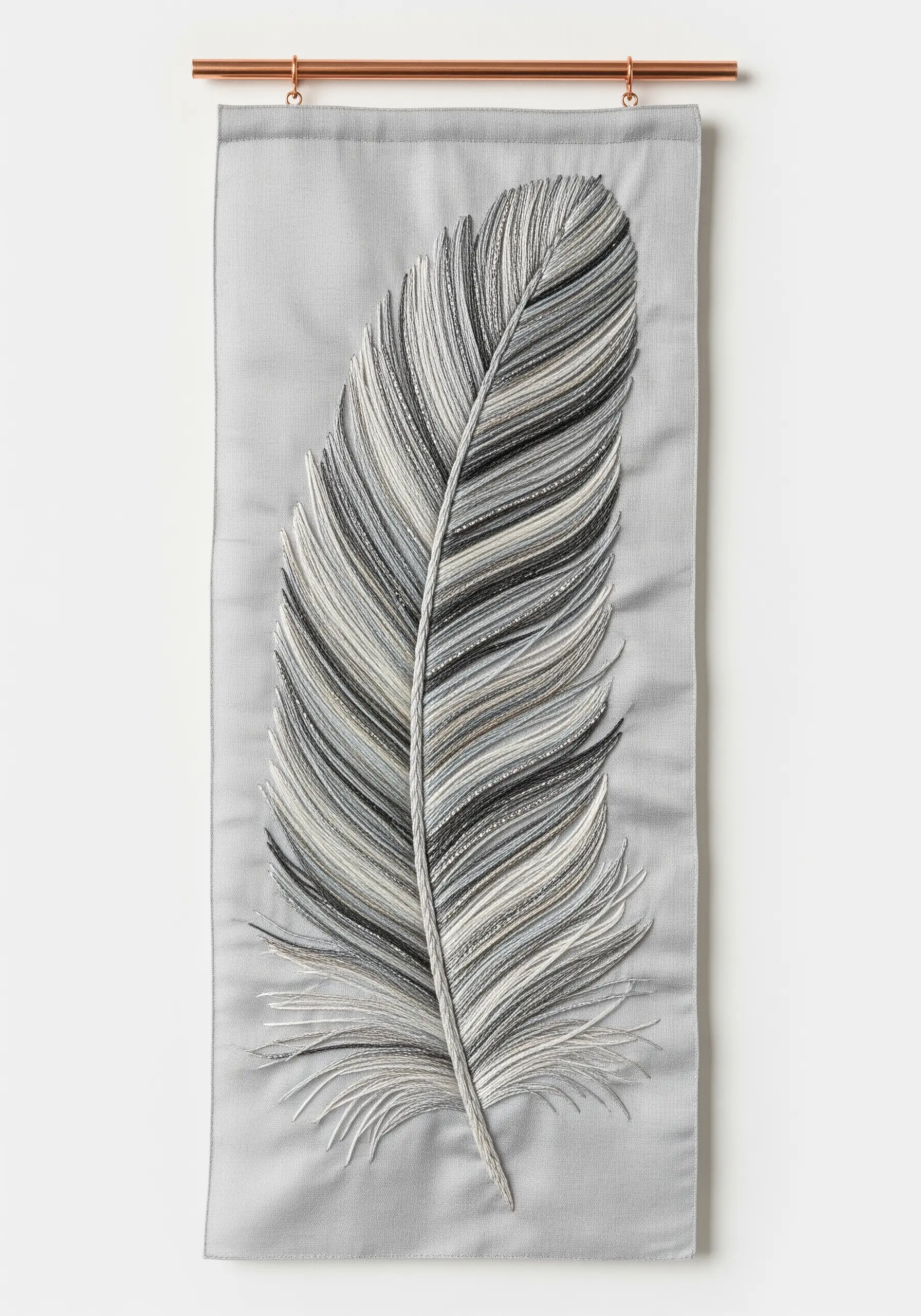 A detailed feather embroidered with long-and-short stitch in shades of grey, black, and white.
