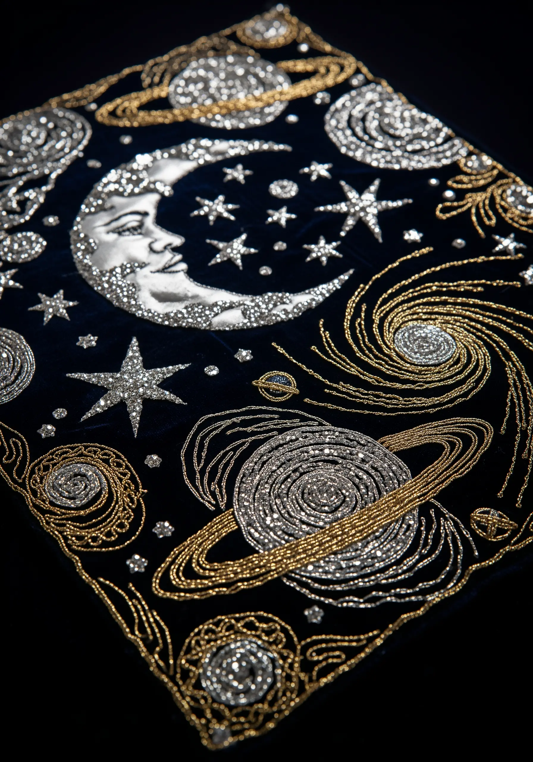 Celestial embroidery on dark velvet with beaded galaxies and a silver lamé moon.