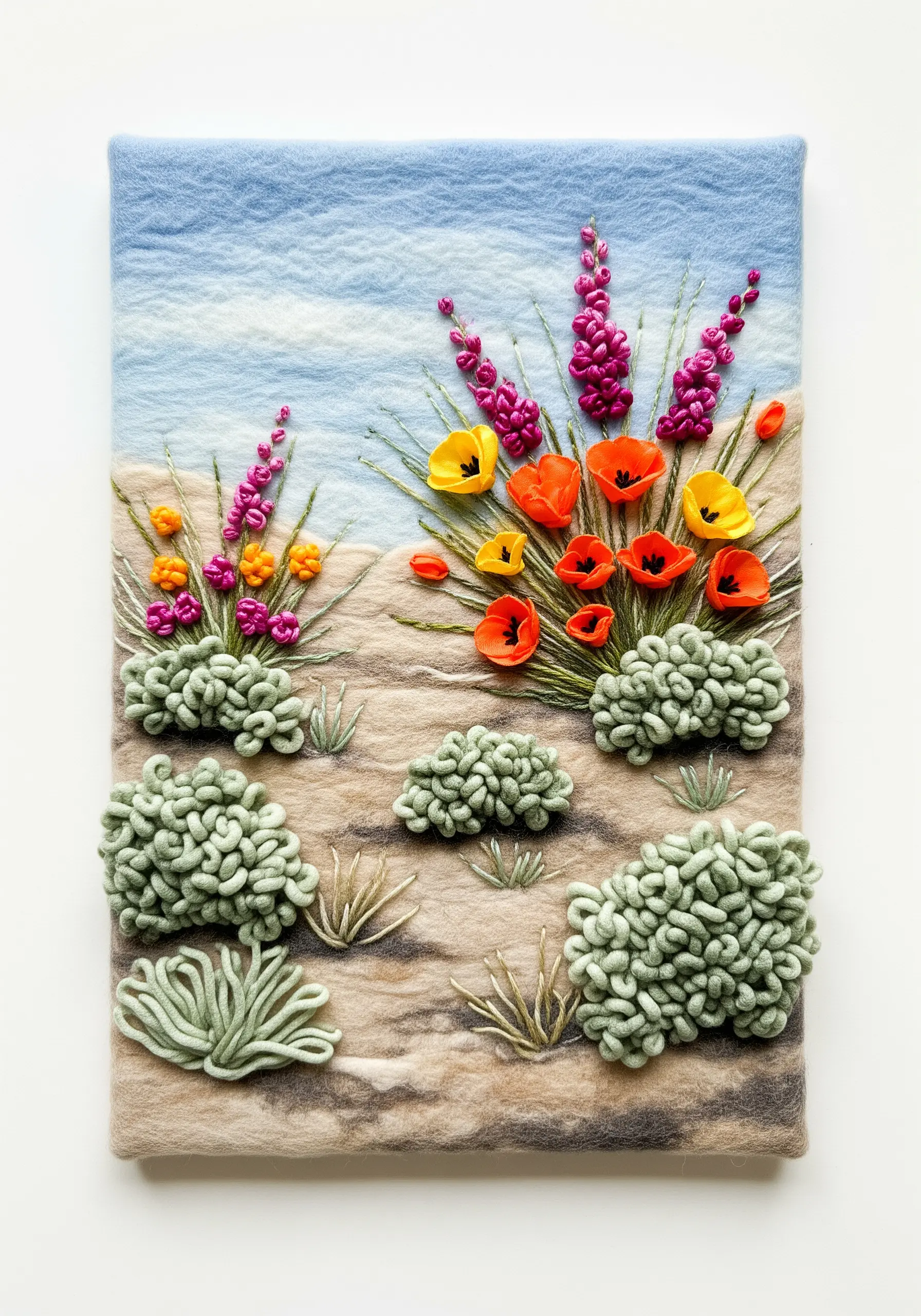 Needle-felted landscape with embroidered flowers and textured yarn bushes.