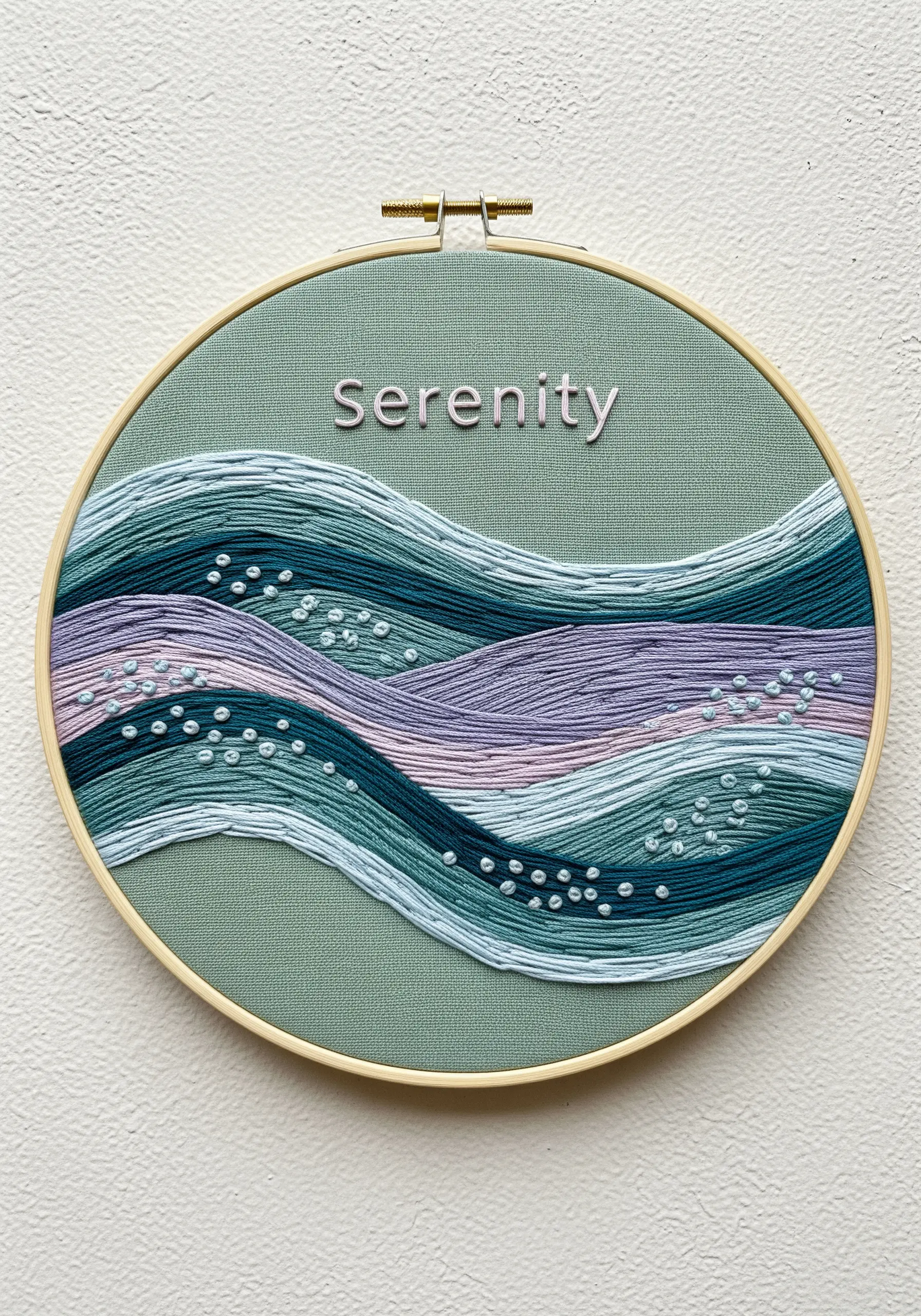 Abstract waves in shades of blue, teal, and lavender stitched on sage green fabric.