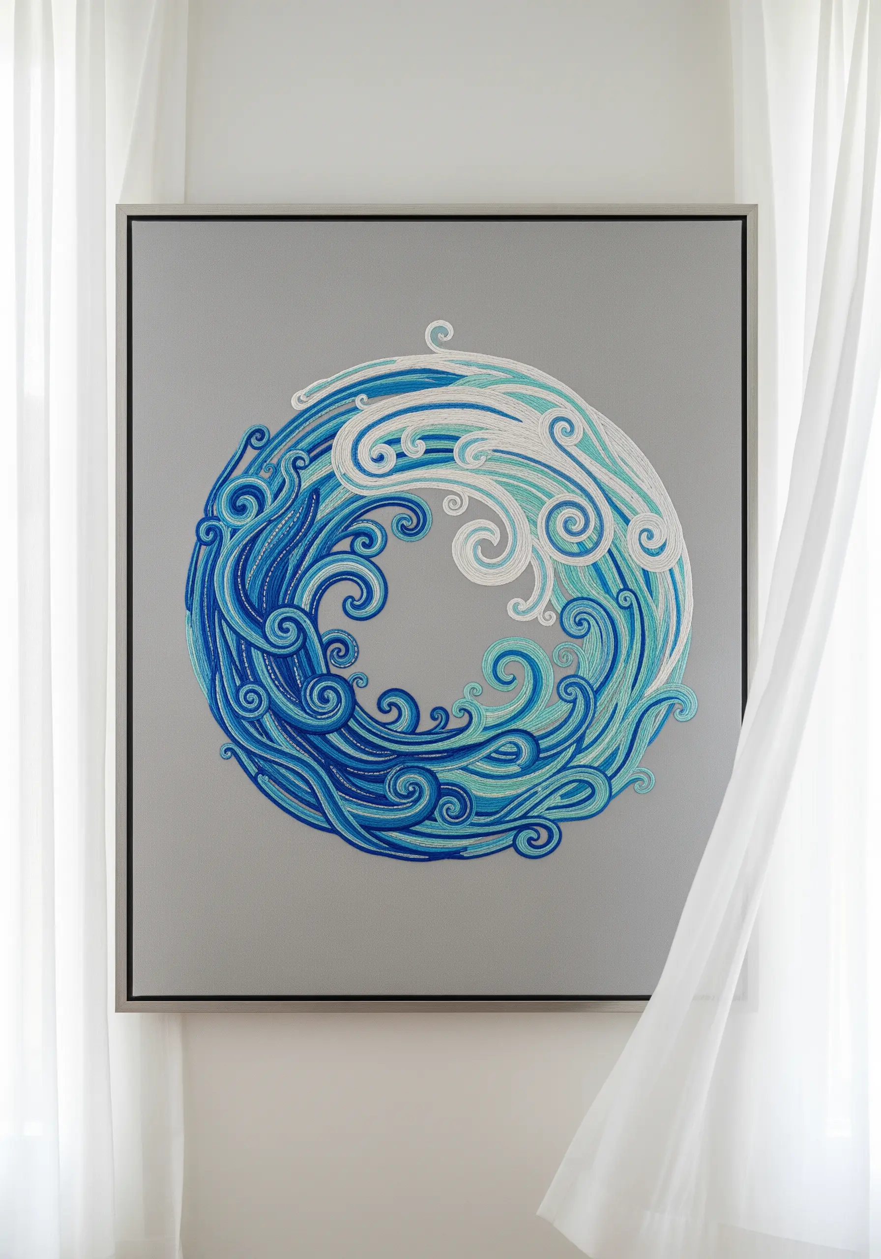 A framed artwork depicting a yin-yang symbol made from flowing, couched yarn in shades of blue.