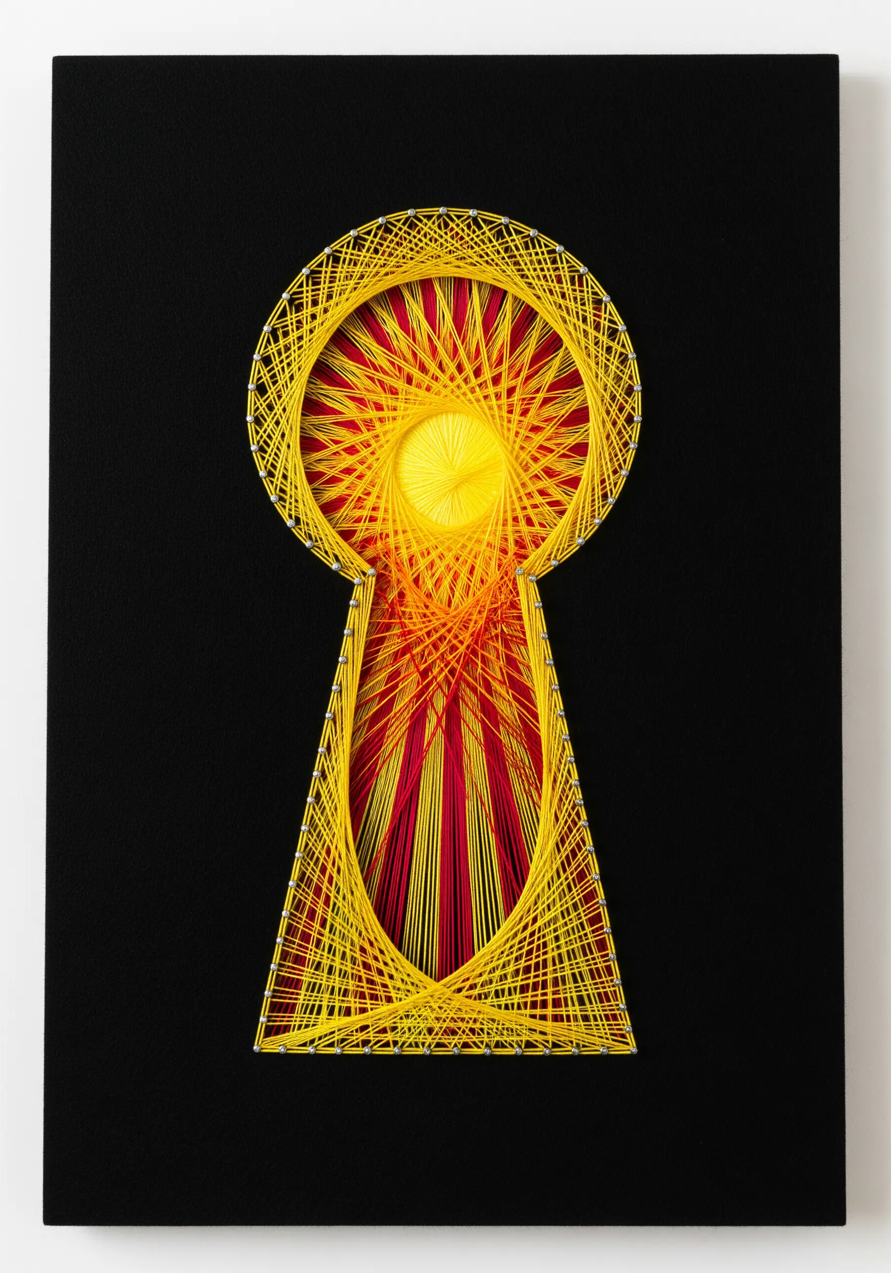 A radiant yellow and red sunburst string art design contained within a black keyhole shape