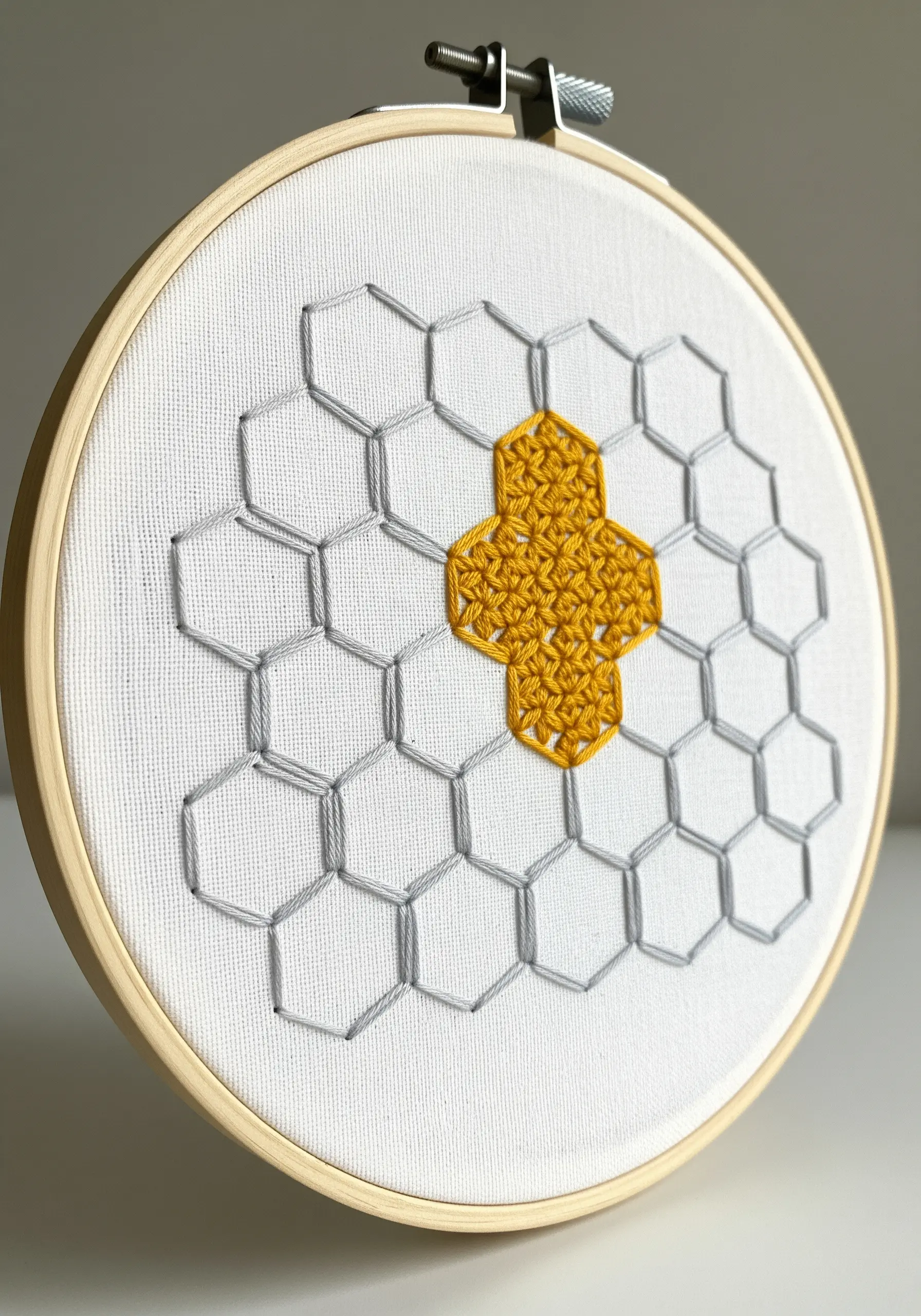Geometric honeycomb pattern with some cells filled in yellow.