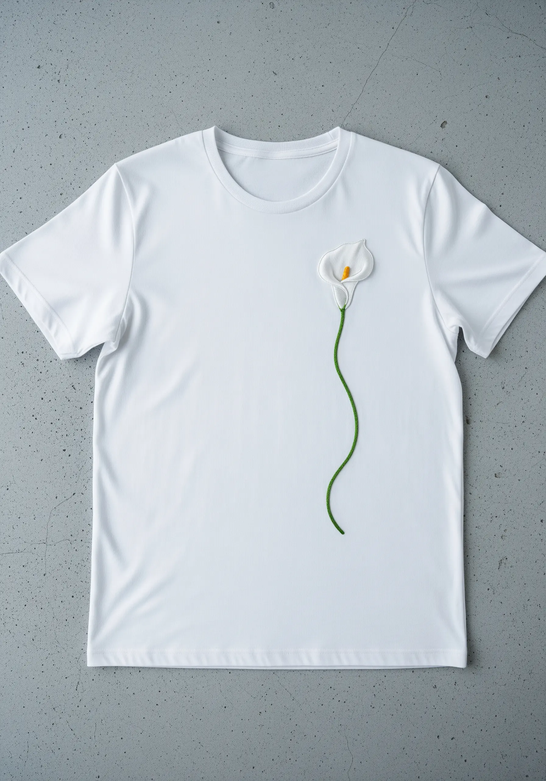 A single white calla lily with a padded, 3D effect on a white t-shirt.