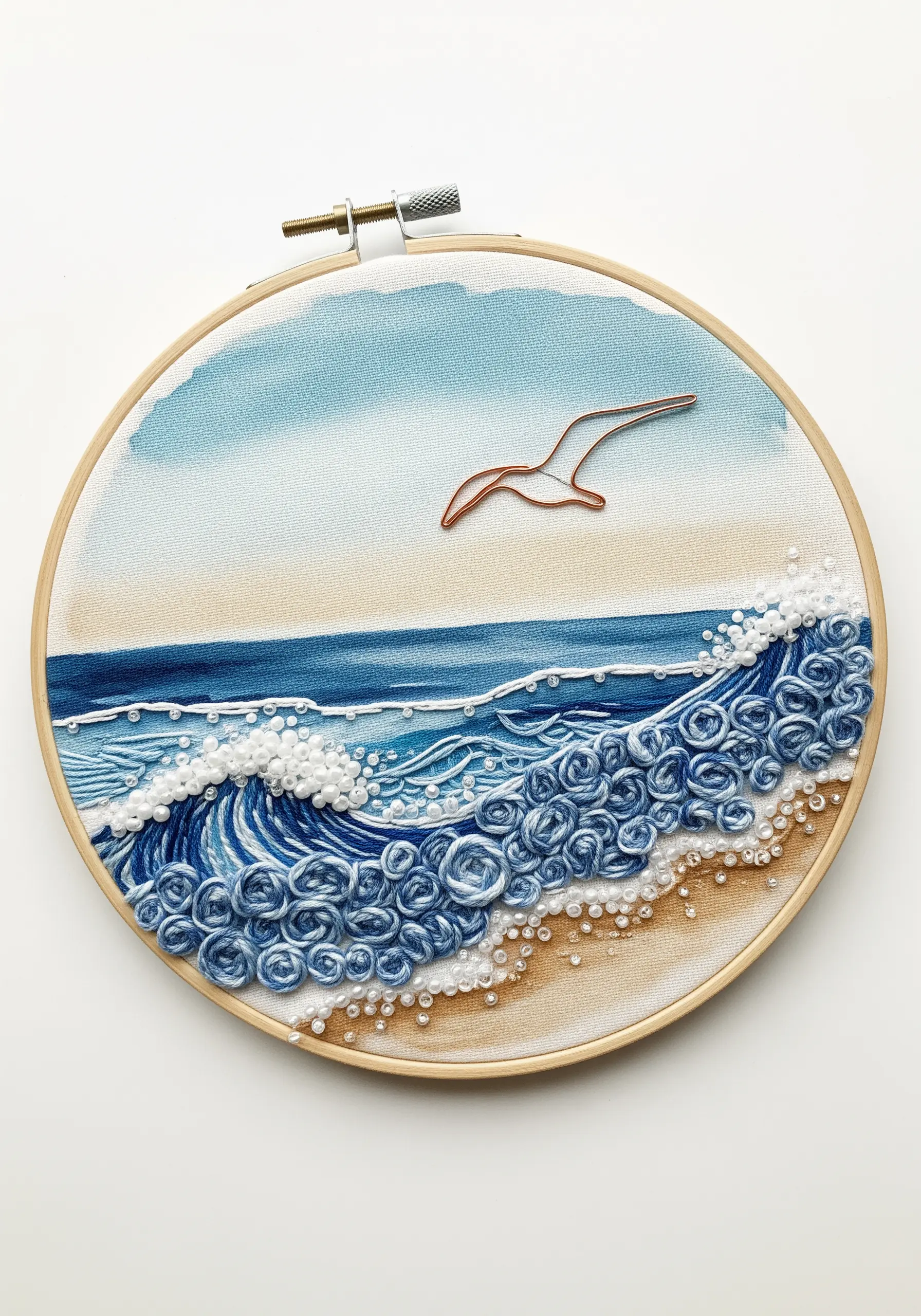 Mixed-media ocean wave embroidery with beads for sea foam and a copper wire seagull.