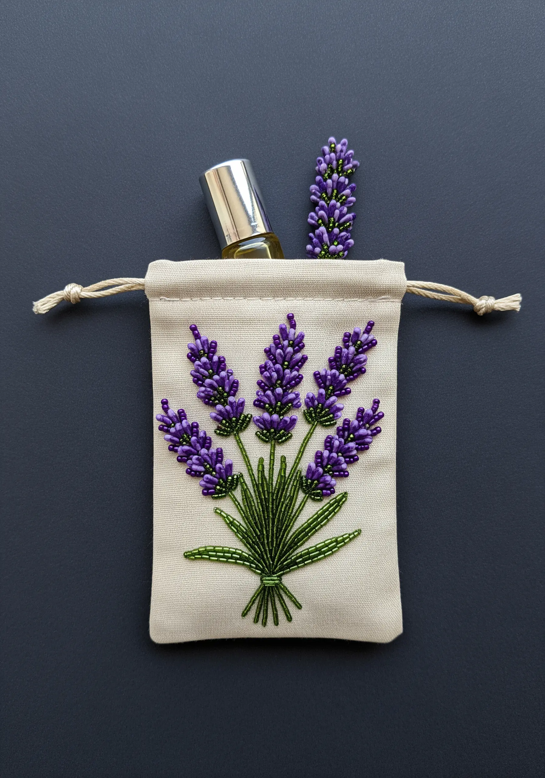 A lavender bouquet on a sachet, with the purple florets created from shimmering seed beads.