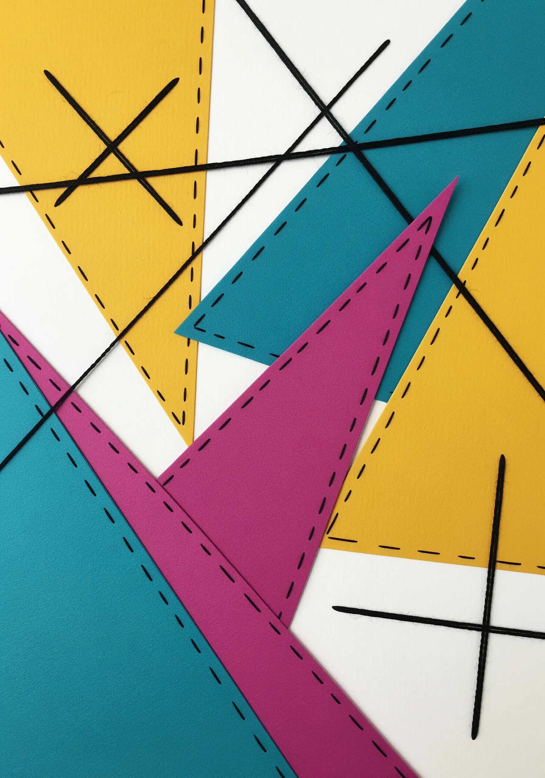Abstract collage of teal, yellow, and magenta triangles with bold black running stitches.