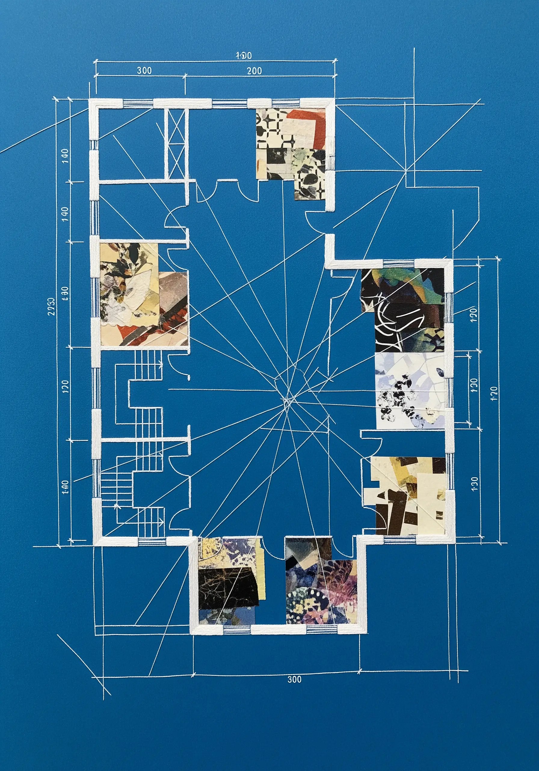An architectural blueprint with several rooms filled in with abstract paper collage.