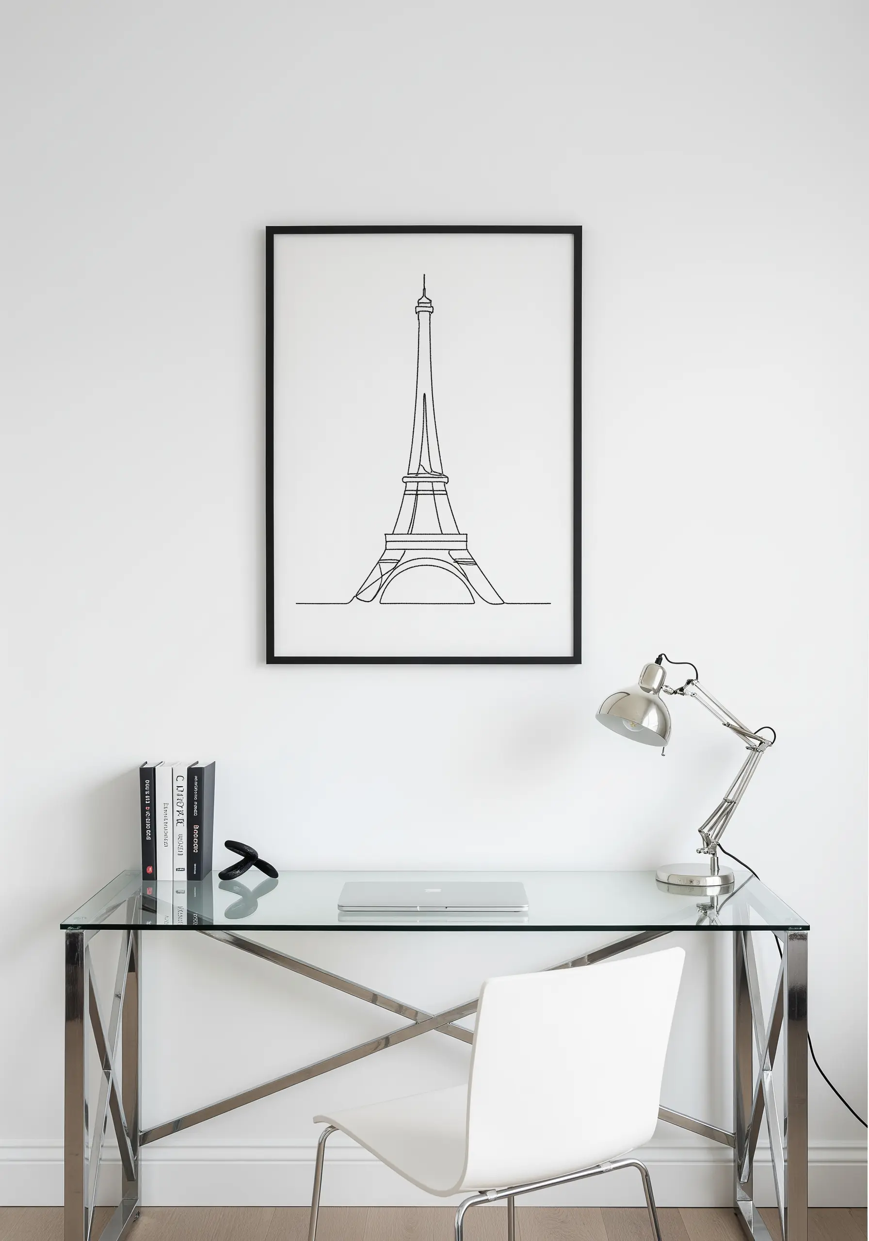 Single-line embroidery of the Eiffel Tower in a minimalist black frame.