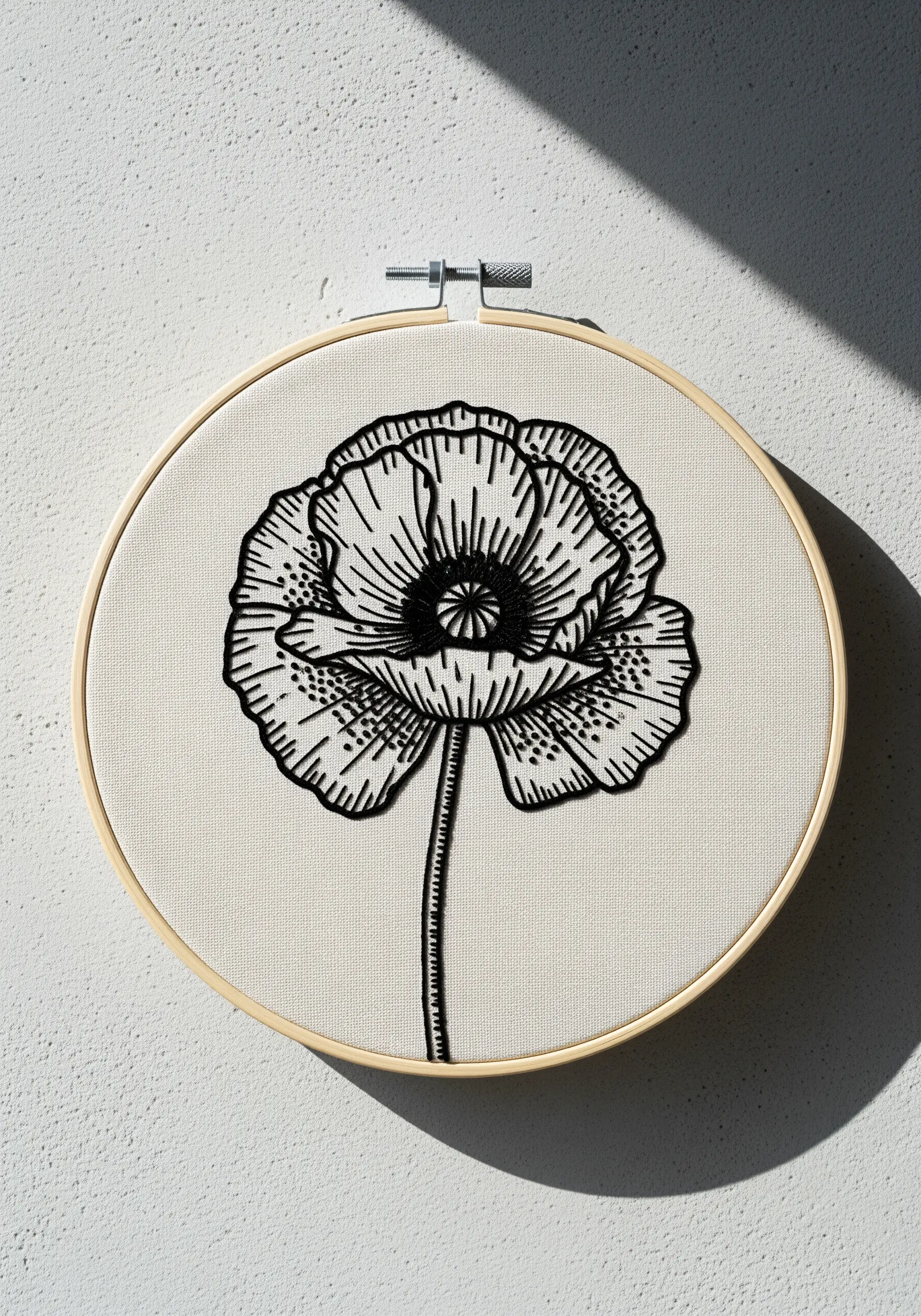 Black thread poppy with detailed linework and shading on off-white fabric.