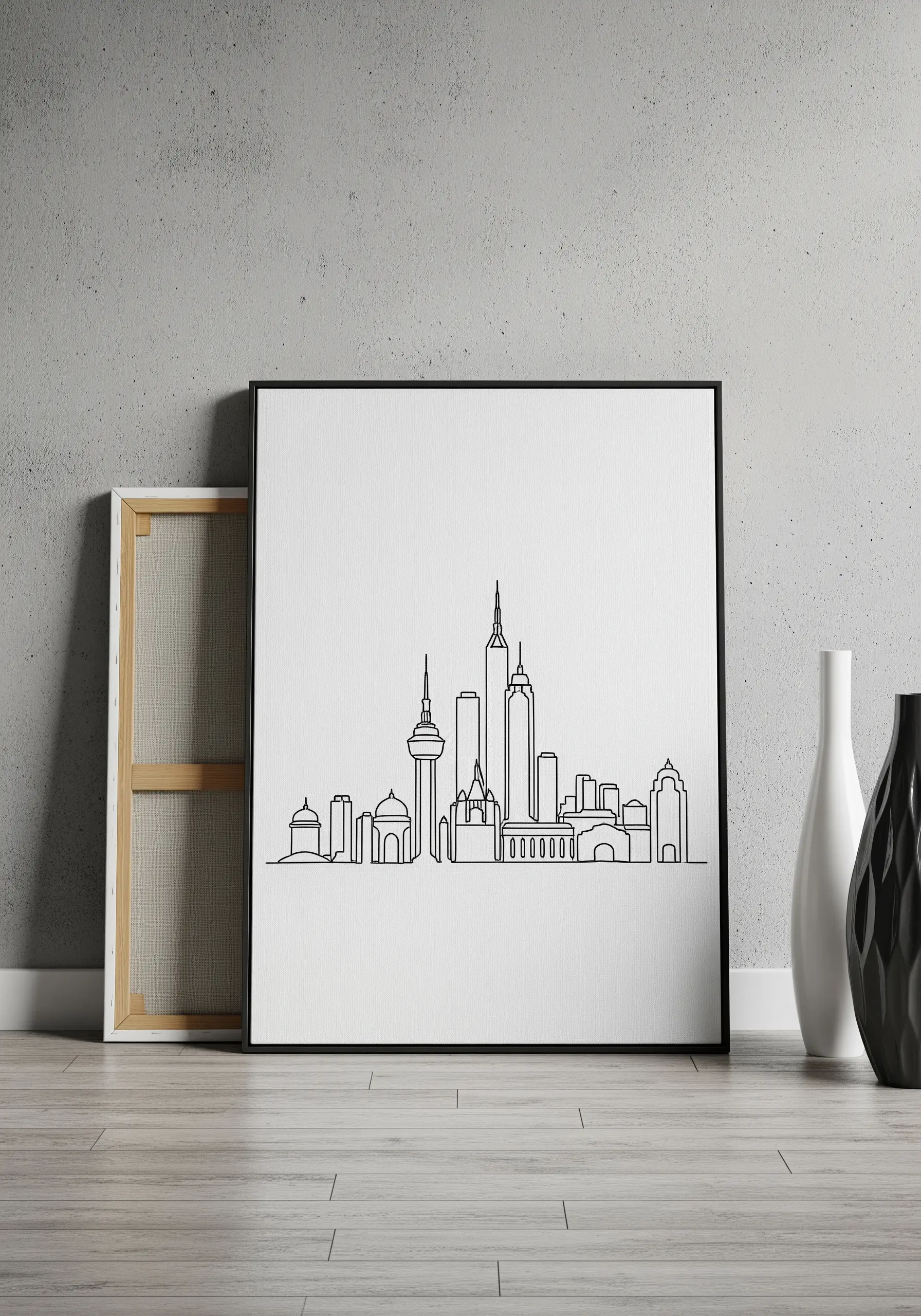 A framed piece of minimalist single-line embroidery depicting a modern city skyline.