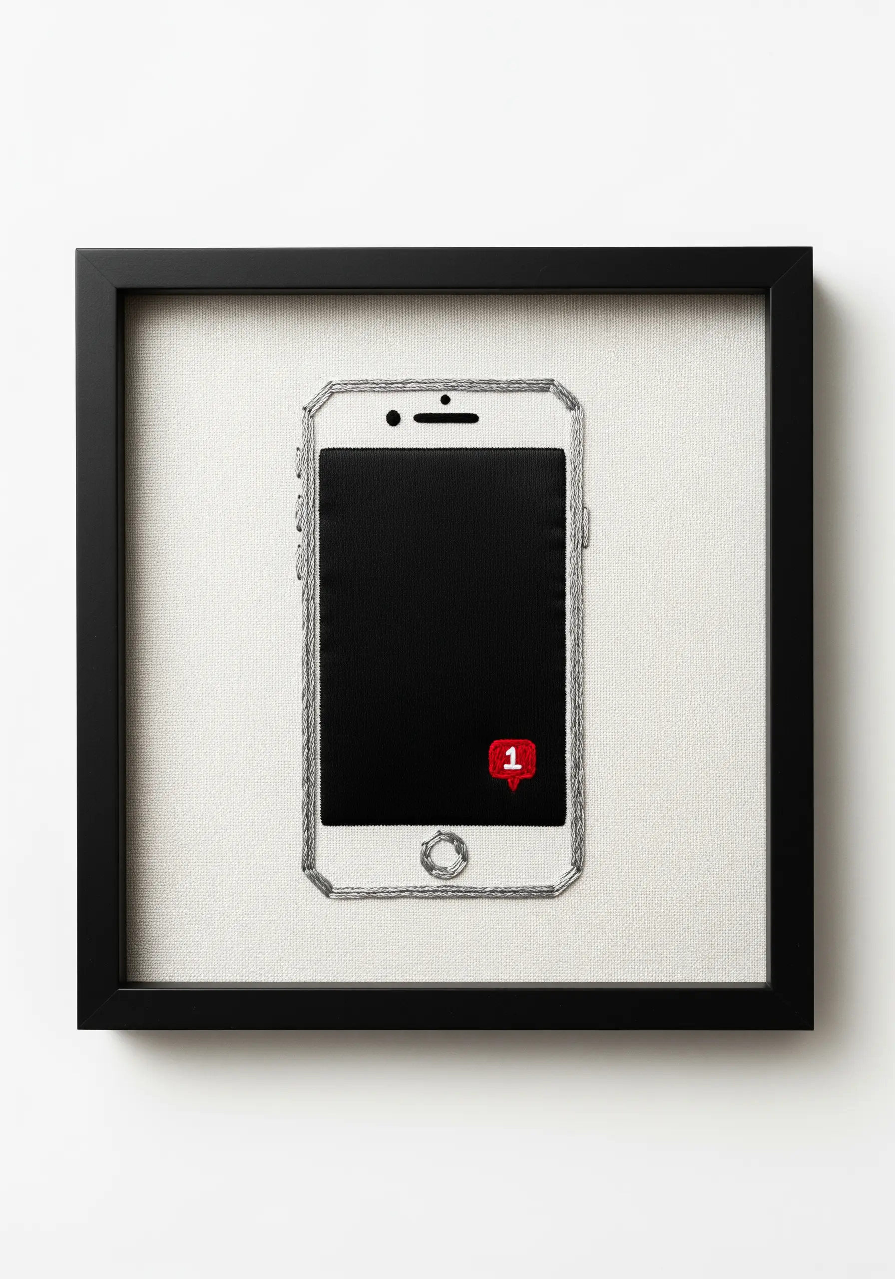 Embroidered smartphone with a red notification icon, framed in black.