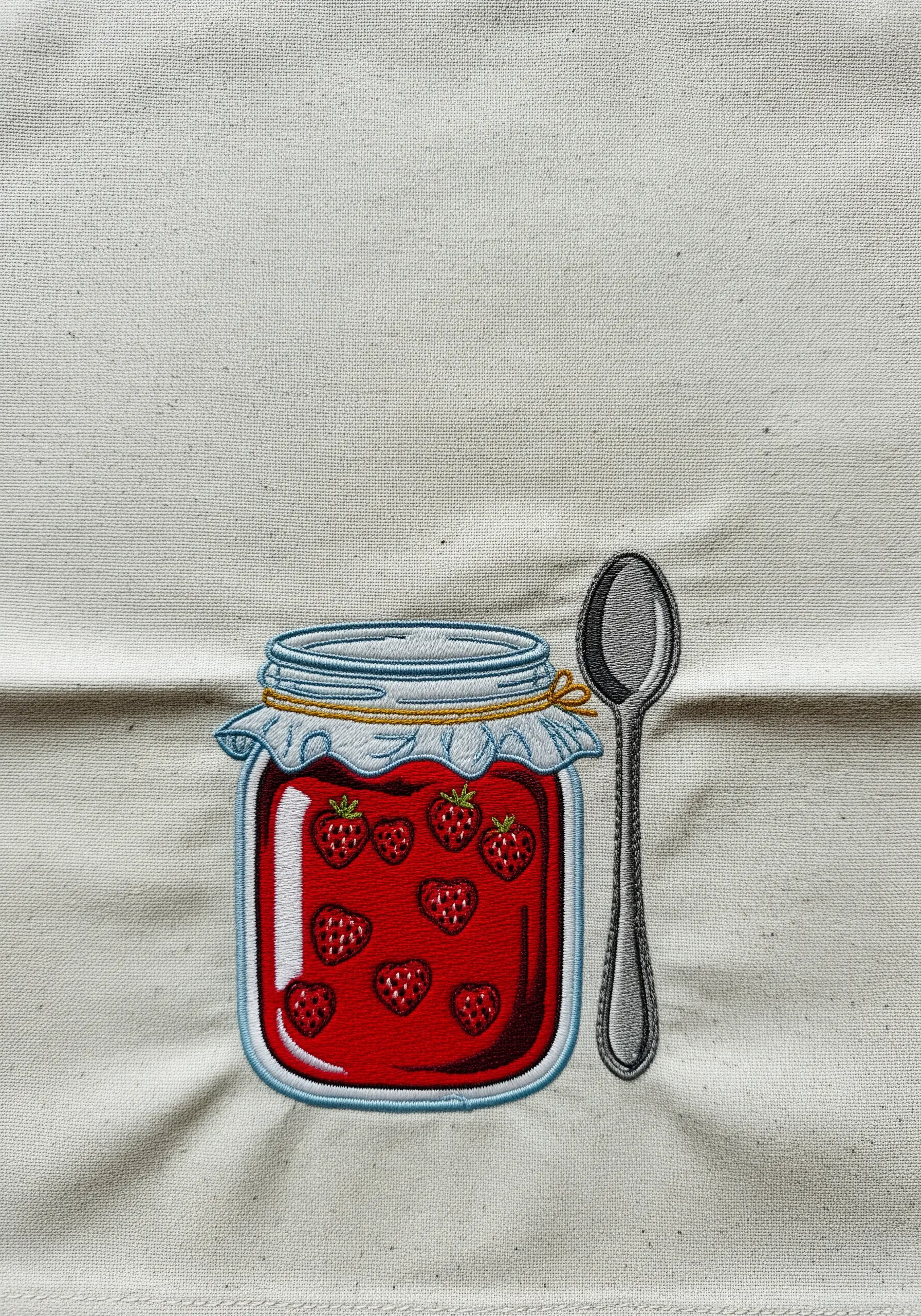 An embroidered jam jar with a shiny red satin stitch fill and glass highlights.