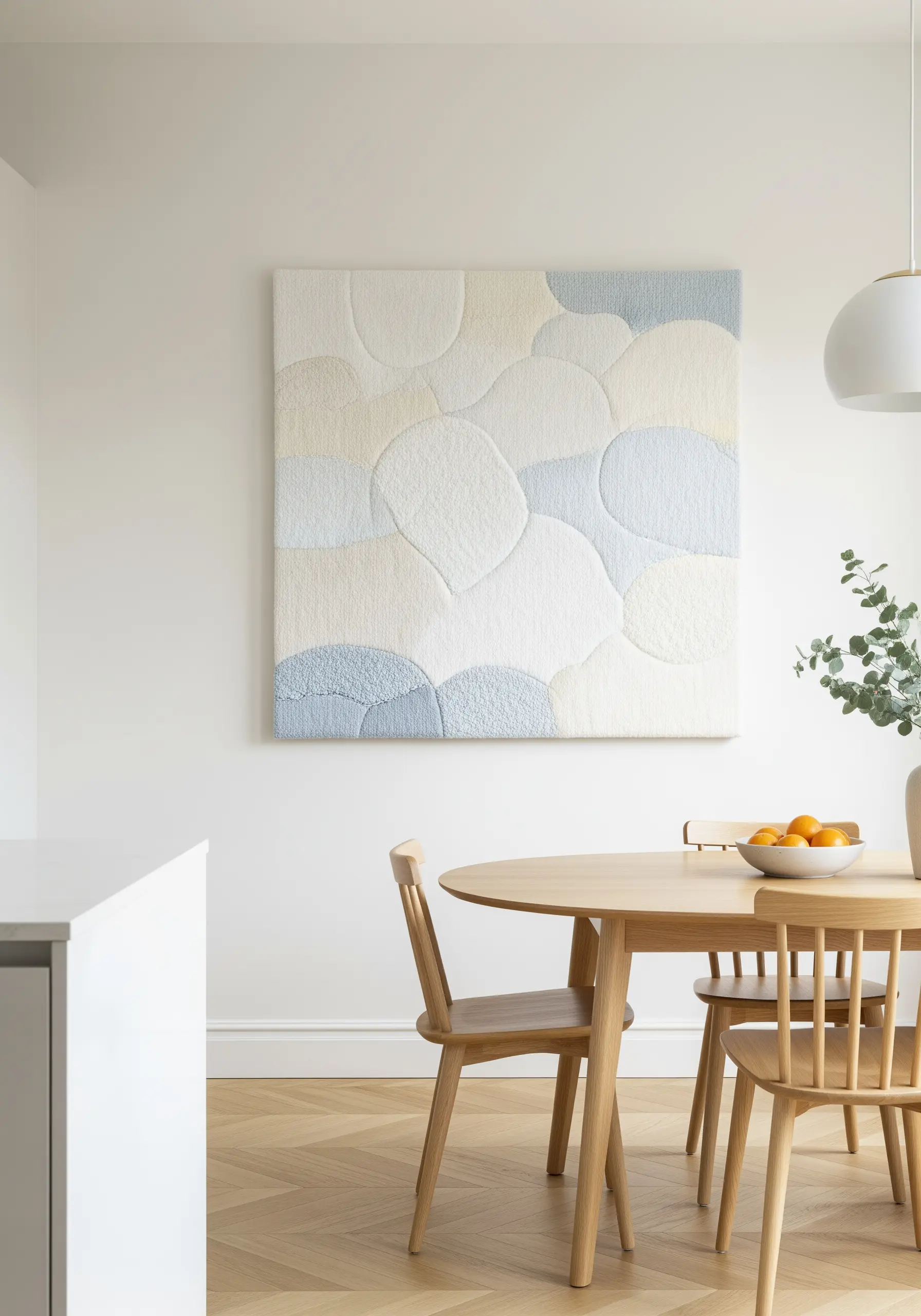 Large, square textile art with soft, overlapping cloud shapes in pastel blues, creams, and whites.