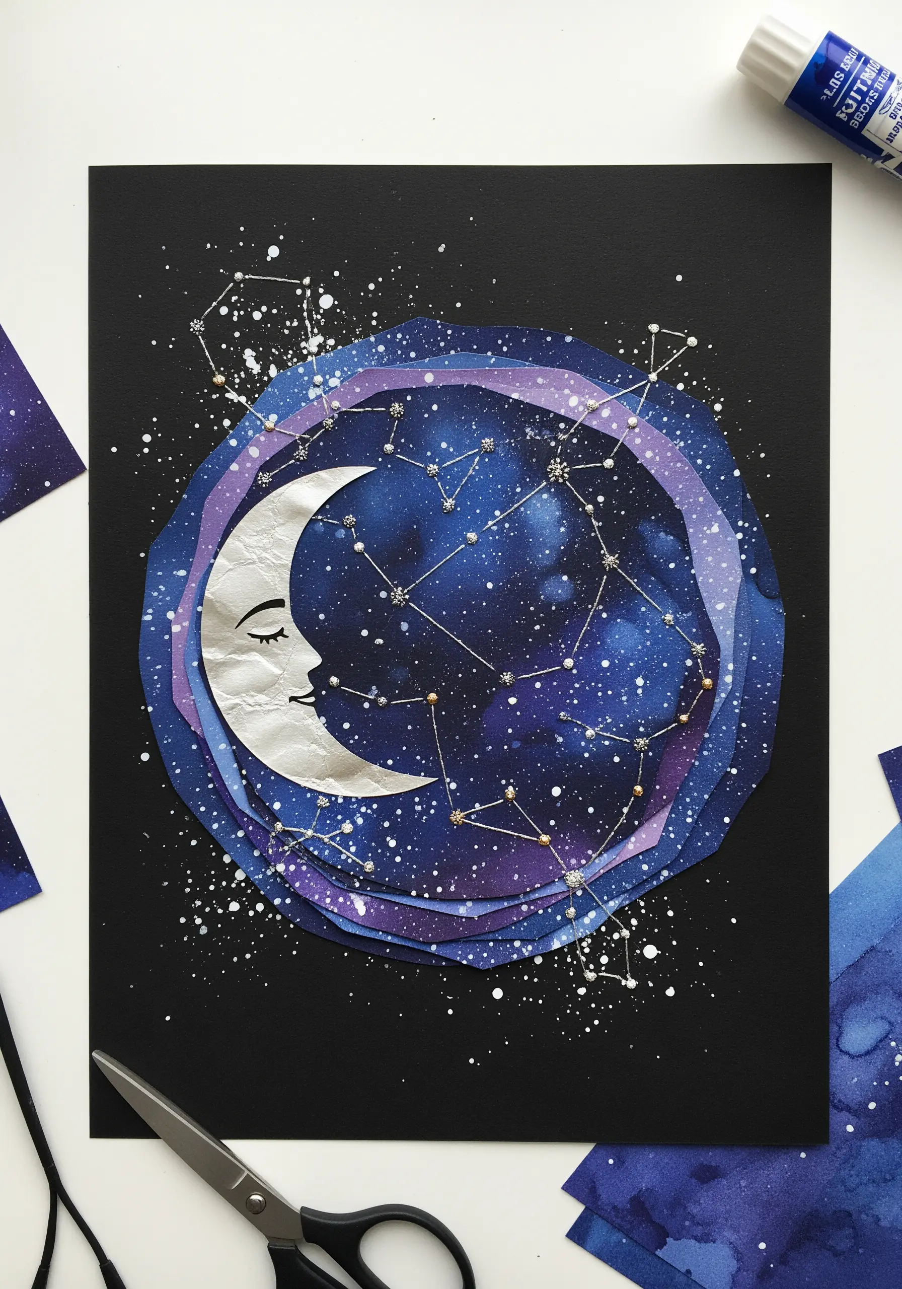 A celestial collage of a crescent moon and galaxy, with silver thread stitched into constellations.