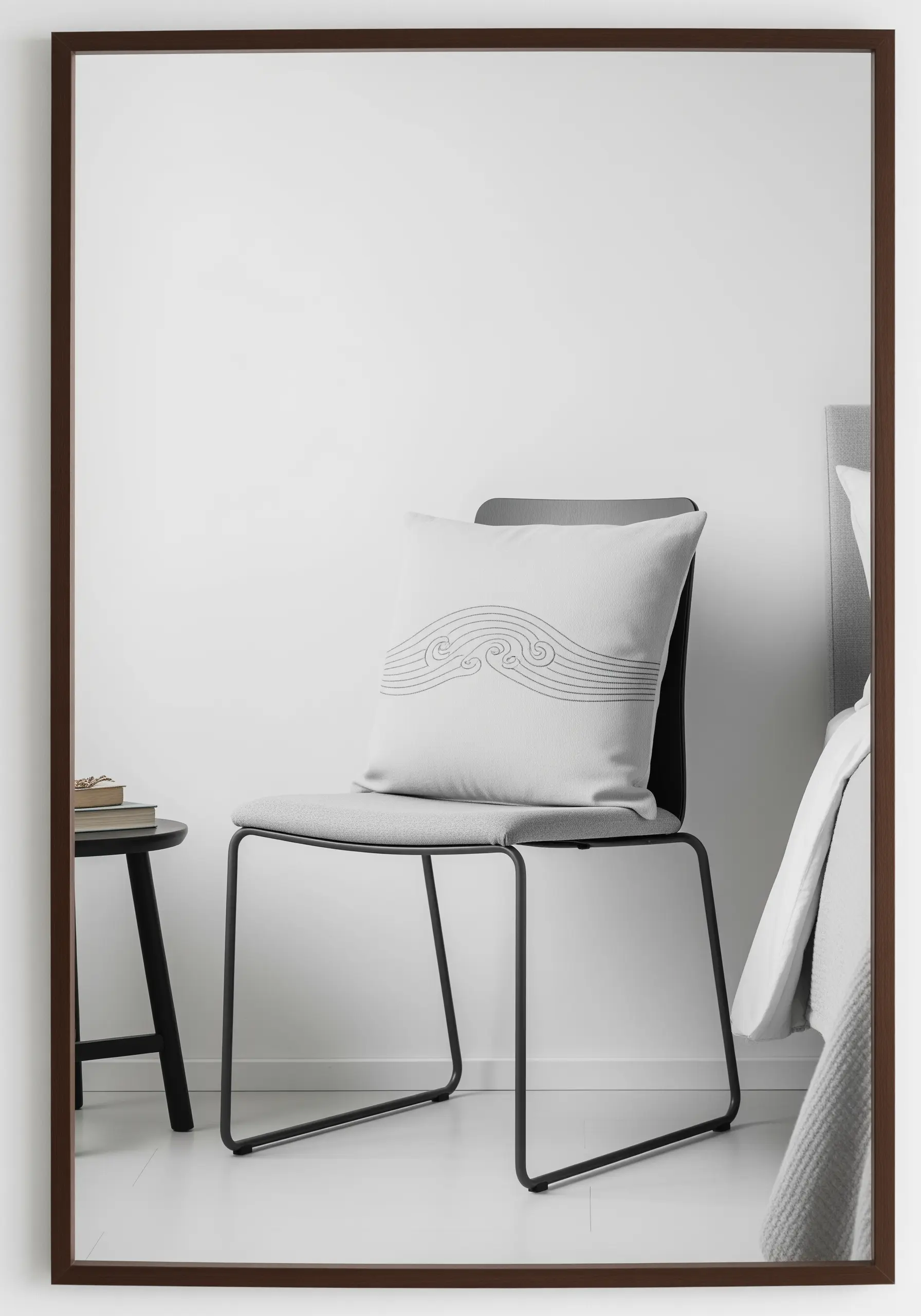 Minimalist embroidered waves in parallel grey lines on a light grey pillow.