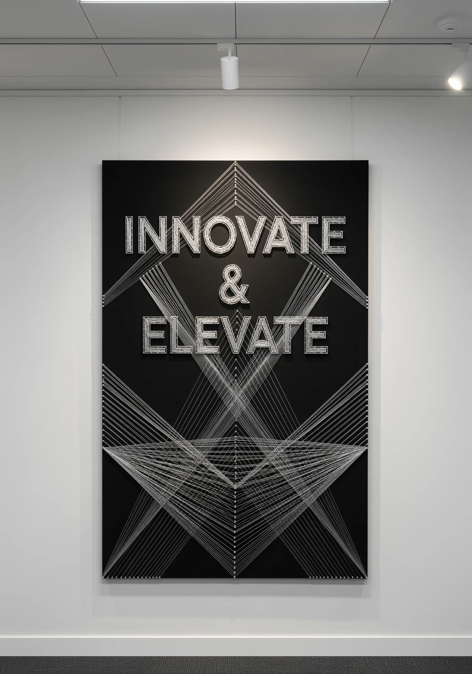 High-contrast black and white string art with sharp geometric lines and the quote 'INNOVATE & ELEVATE.'