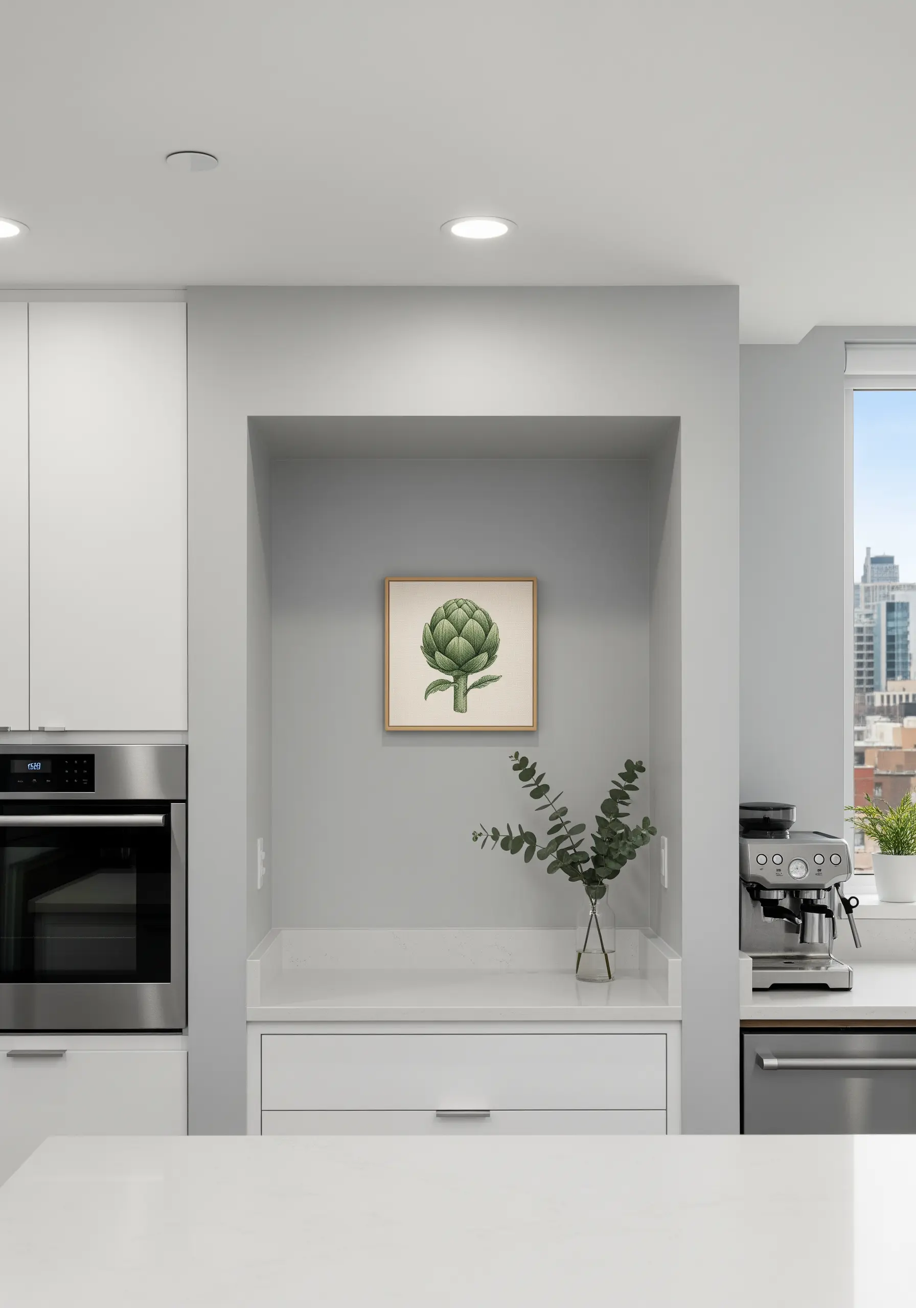 Framed embroidery of a green artichoke centered in a kitchen wall niche.
