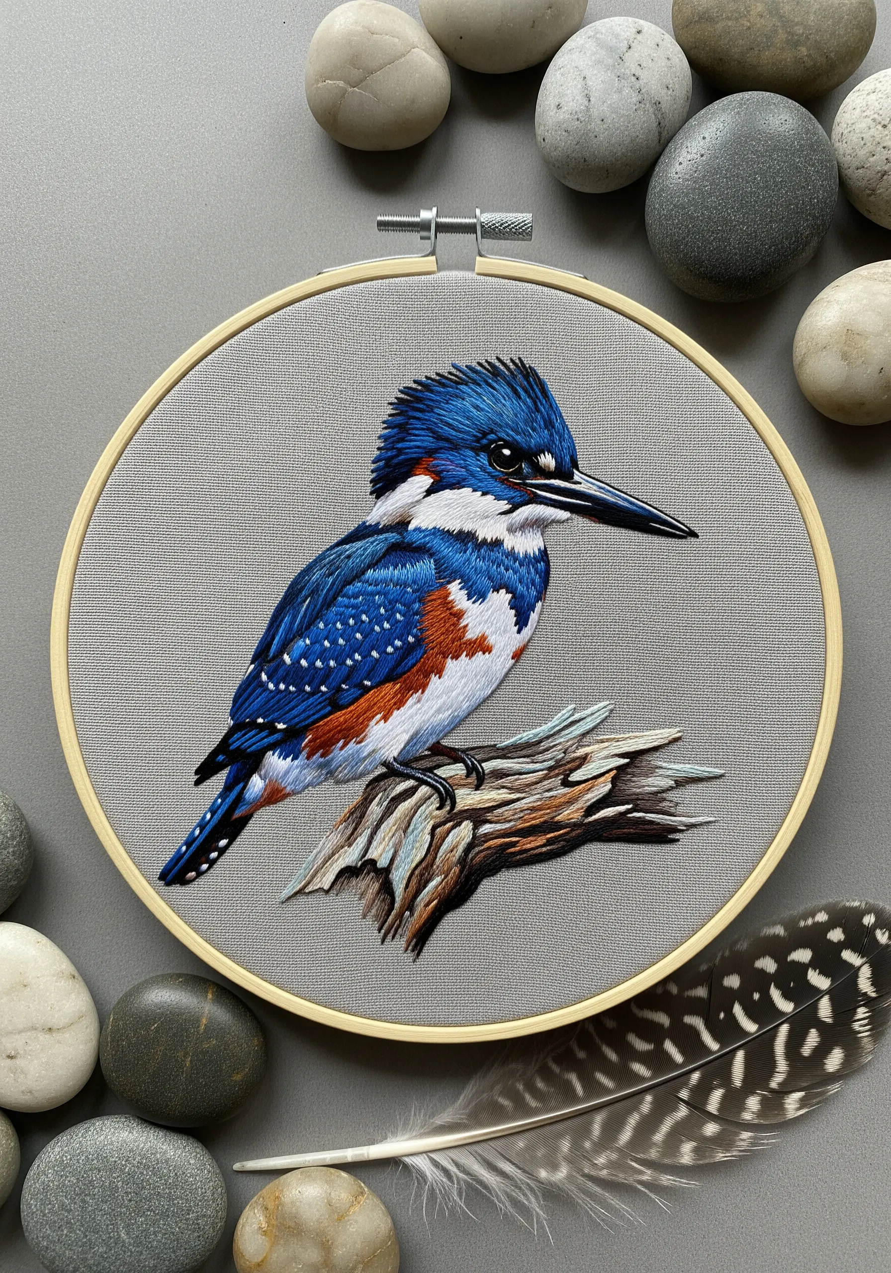 A vibrant kingfisher embroidery with glossy blue feathers and matte orange and white details.