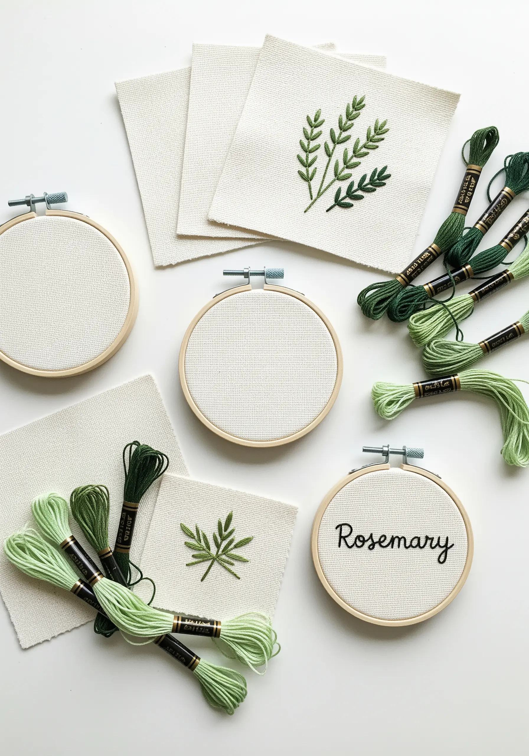 Small embroidered patches of herbs like rosemary, with hoops and thread.