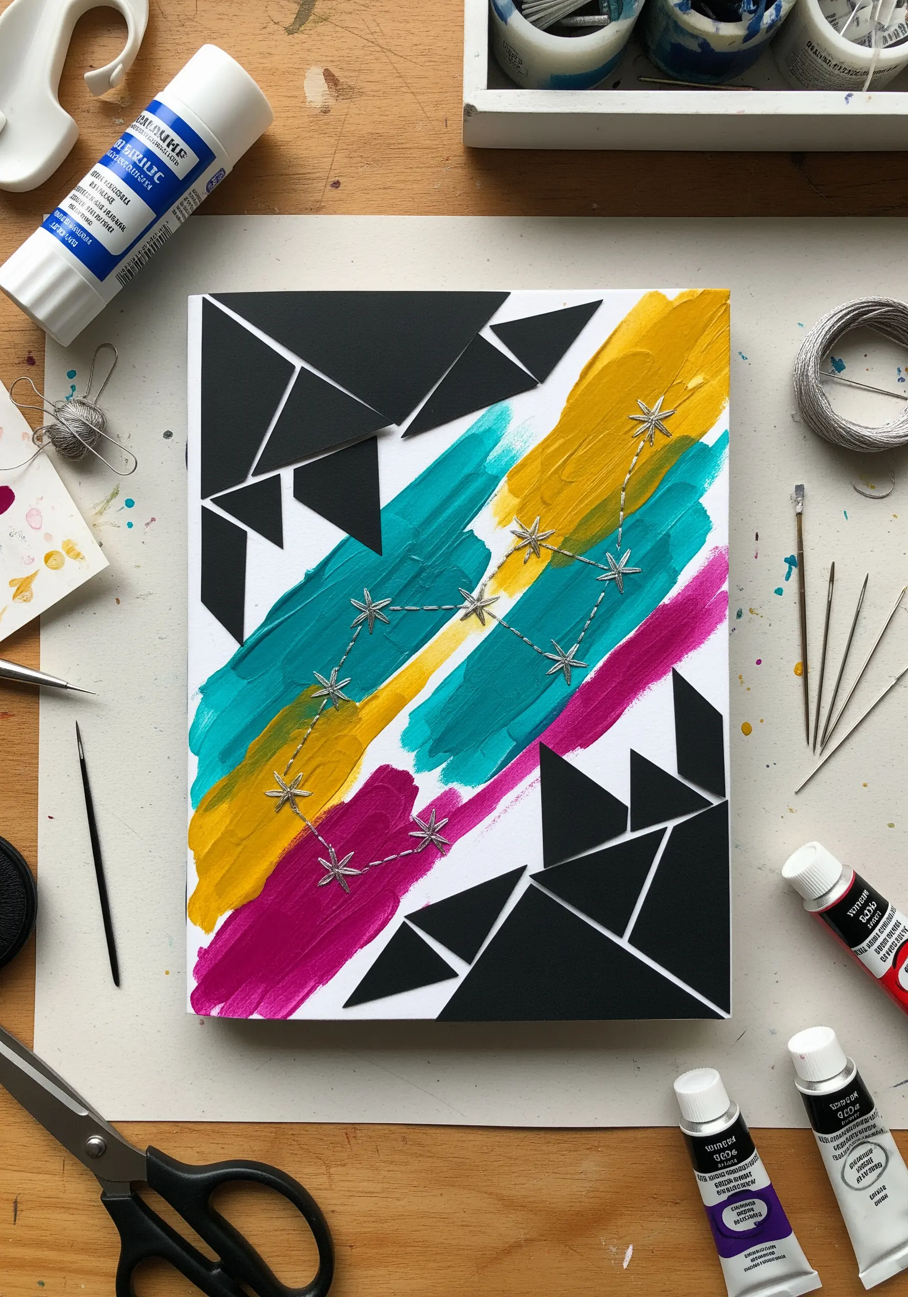 Abstract painting with stitched constellation in silver thread over paper collage.