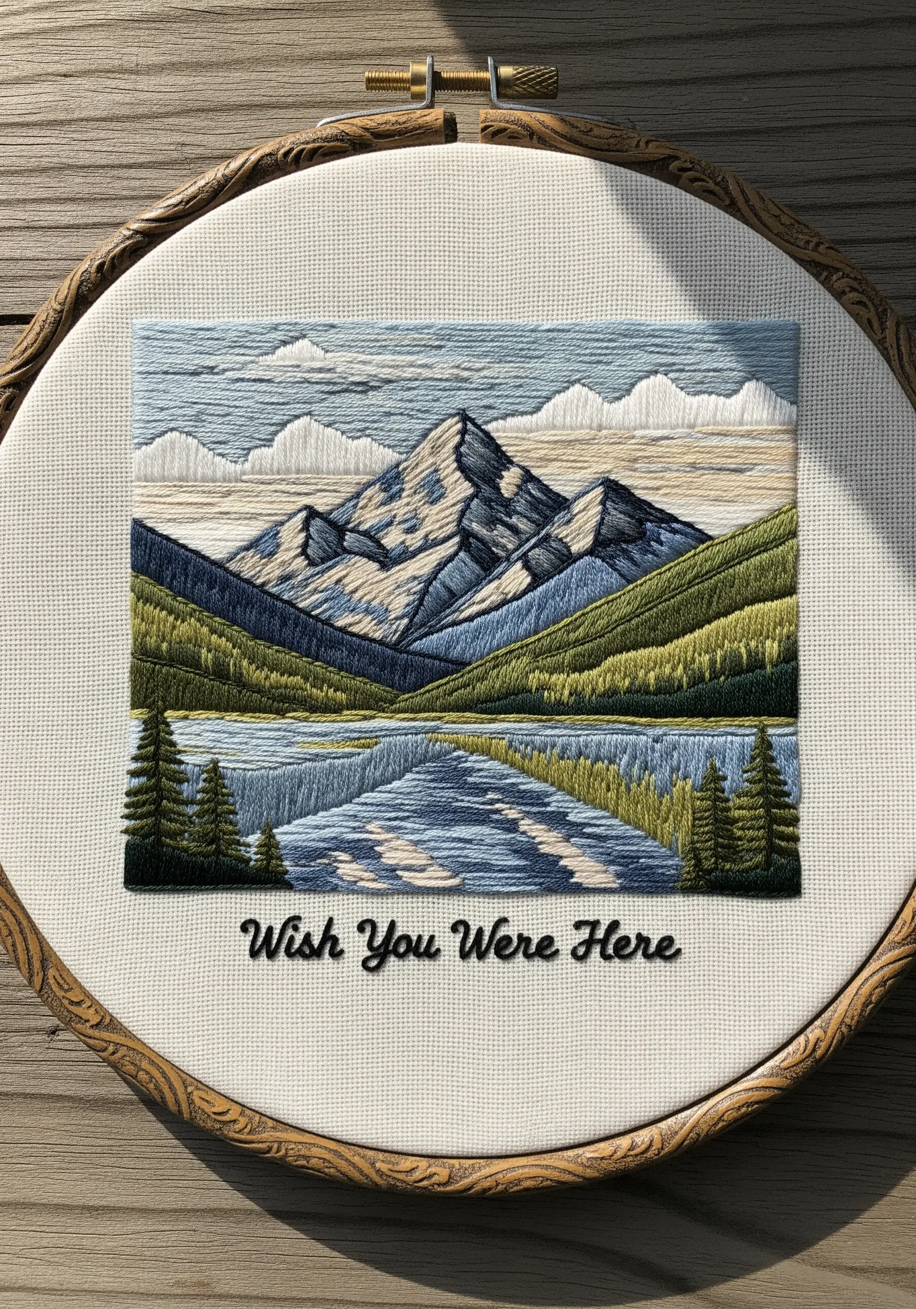 Stylized mountain landscape embroidery with crisp, color-blocked sections.