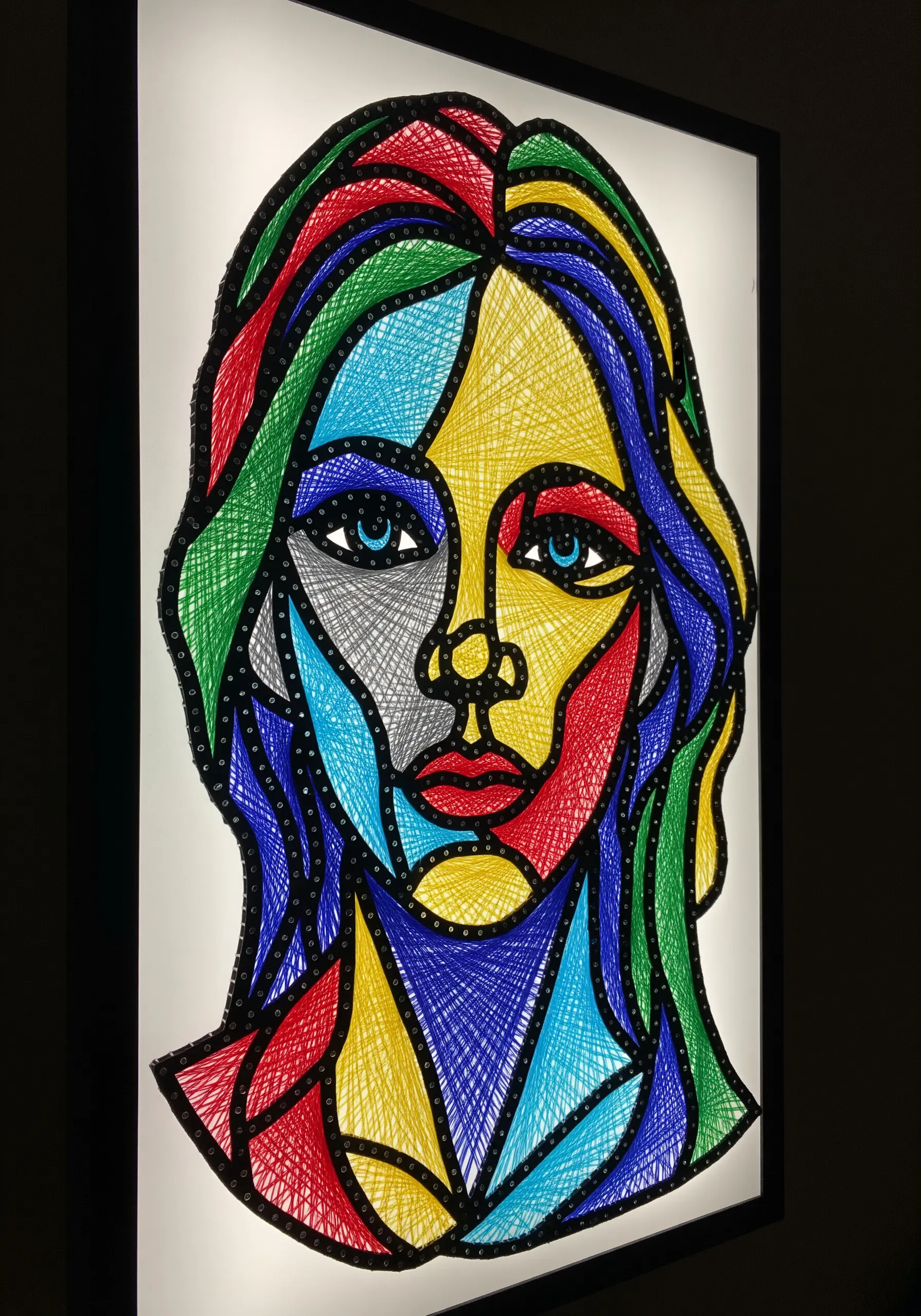 A string art portrait with a stained-glass effect, using bold black outlines and vibrant colors.