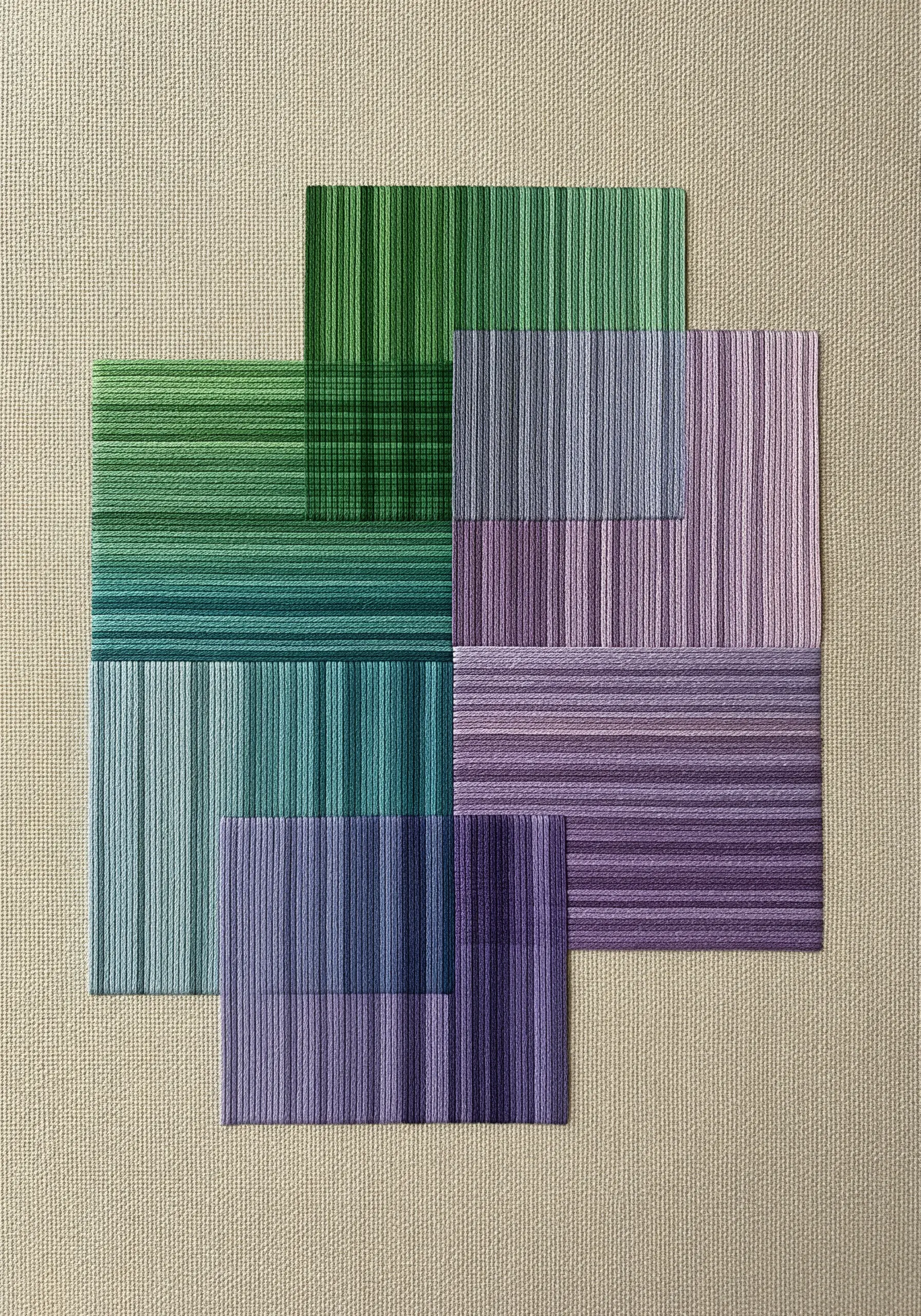 Abstract geometric design with overlapping blocks of green and purple satin stitches.