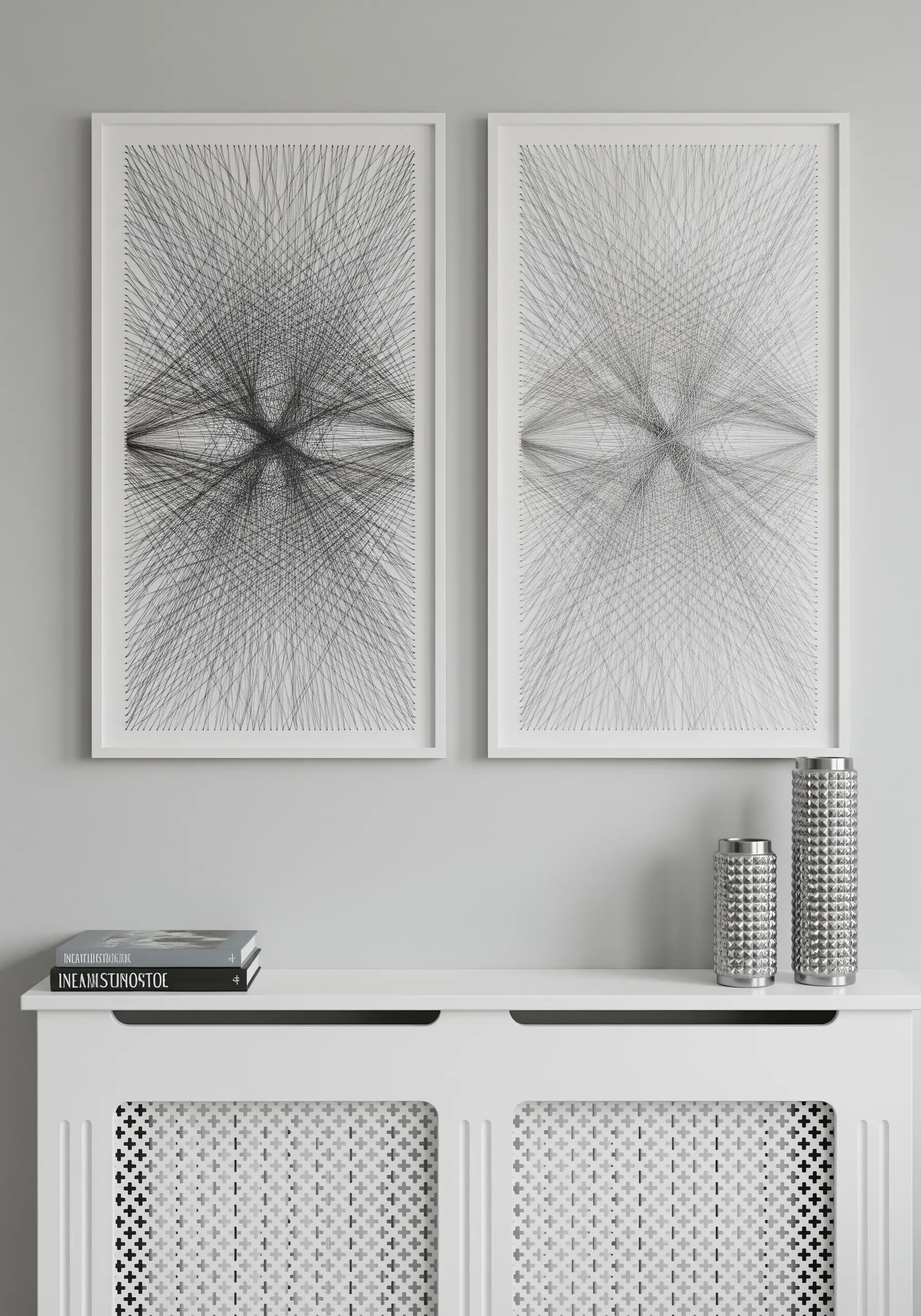 Two large frames with intricate, symmetrical black line art creating an optical effect.