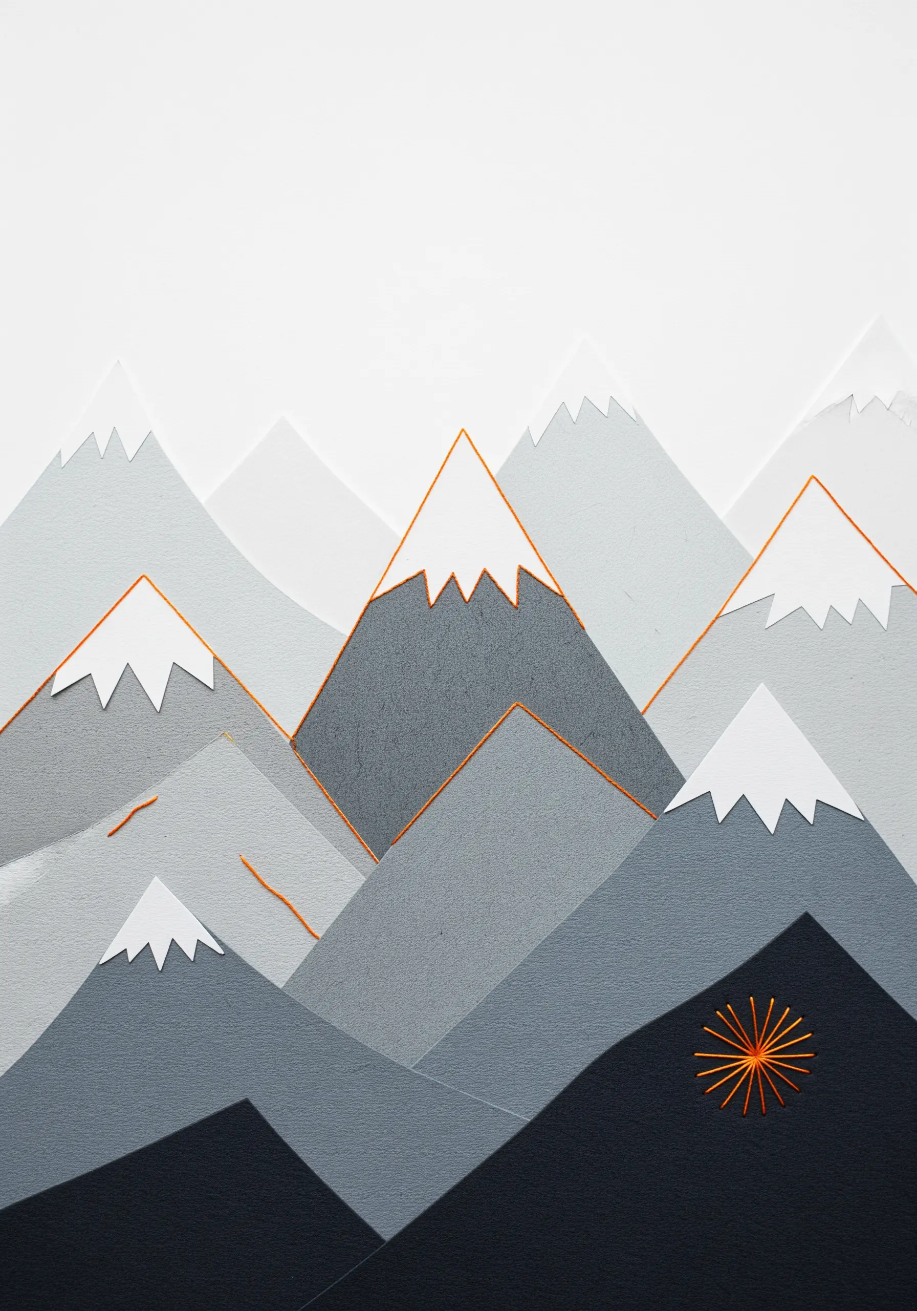 A minimalist paper collage of mountains with a small, graphic sunburst embroidered in orange thread.