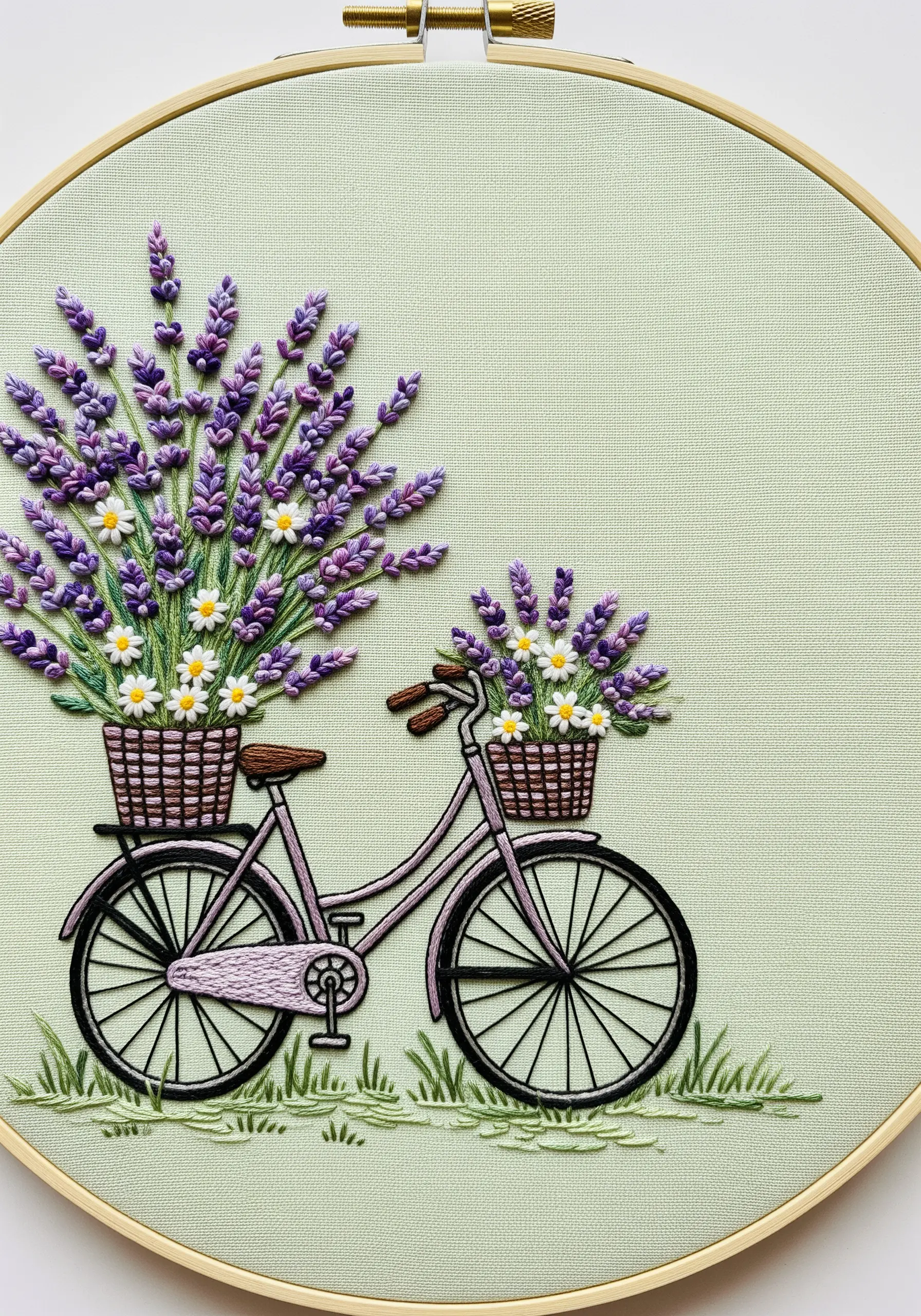 An embroidered bicycle with baskets overflowing with lavender and daisies.