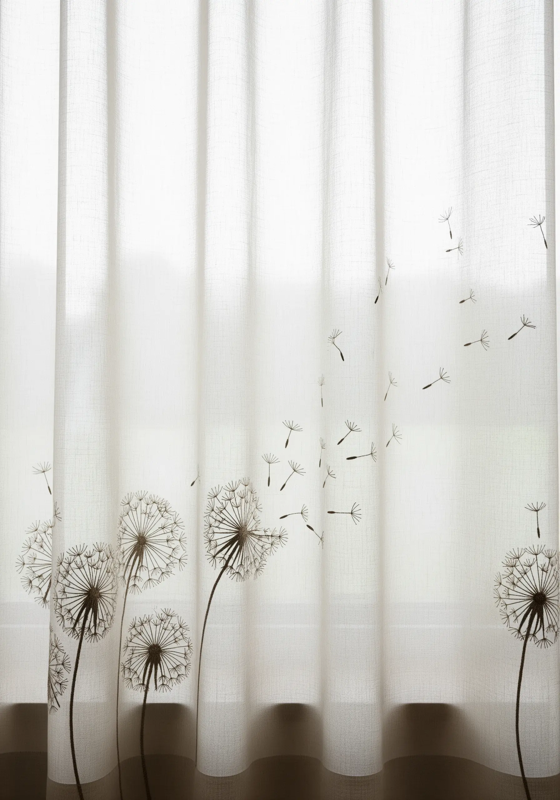 Sheer white curtains embroidered with dandelion clocks and seeds blowing in the wind.