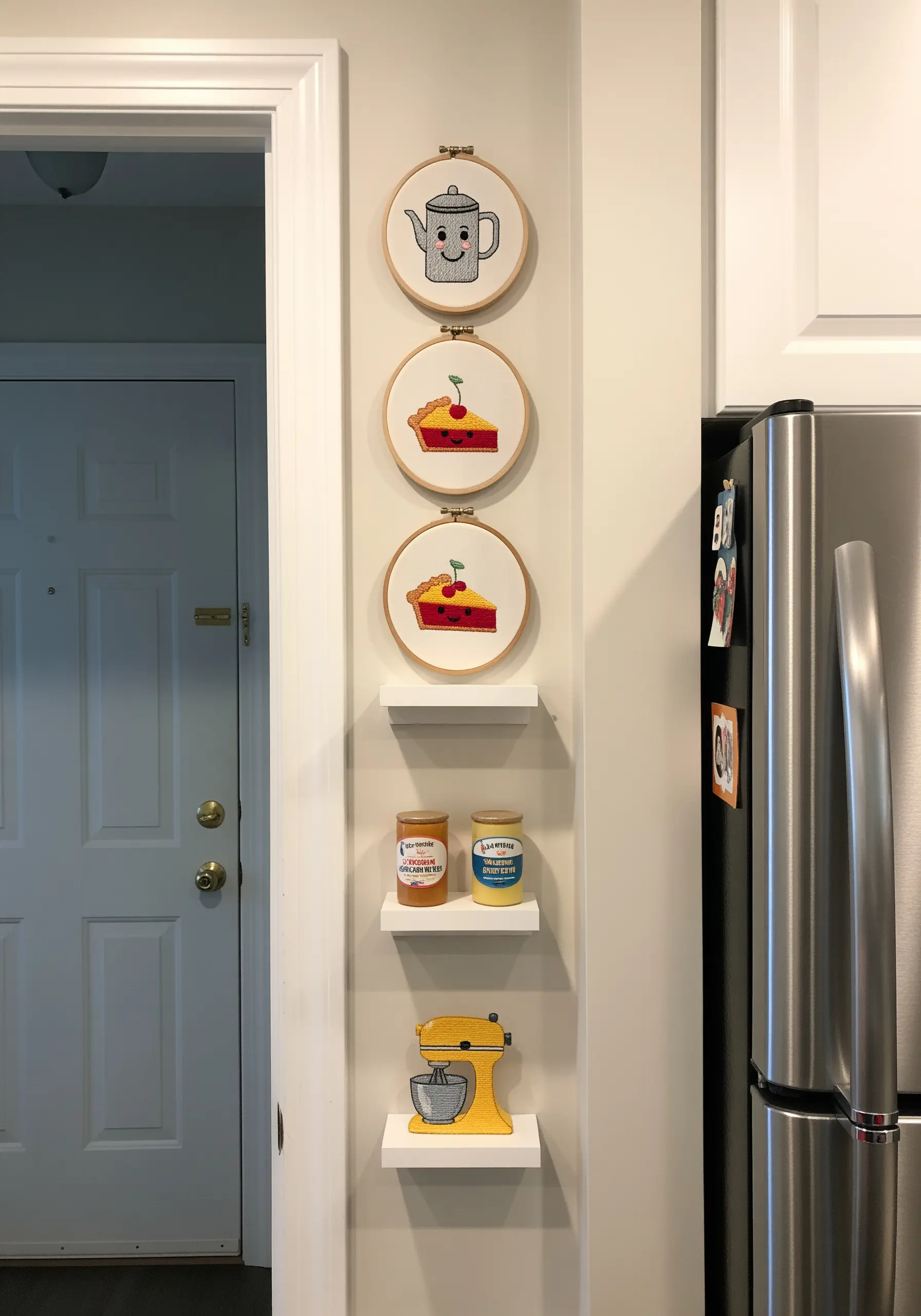 Three embroidery hoops with cute kitchen-themed designs: a coffee pot, a slice of pie, and a mixer