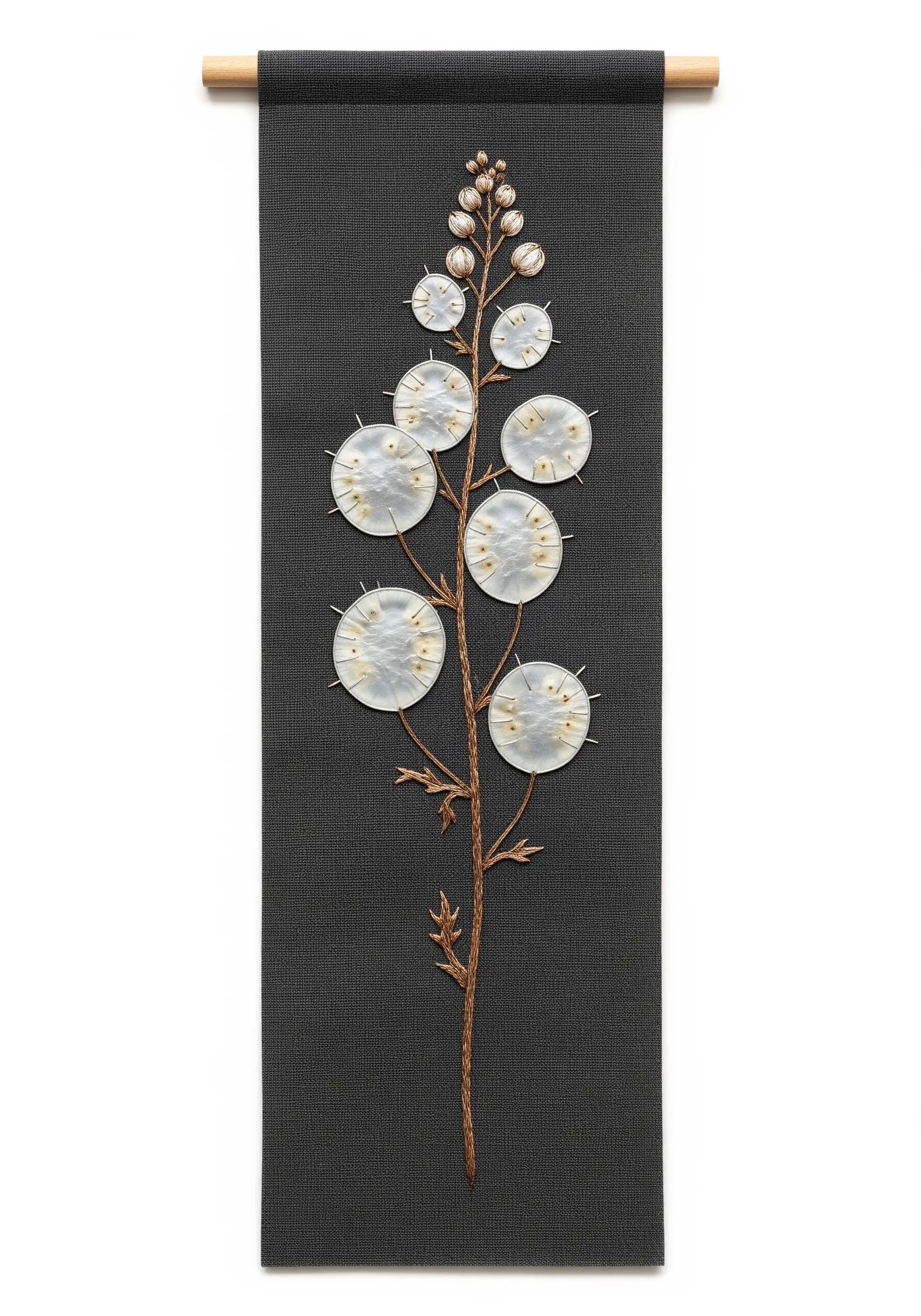 Embroidered lunaria plant with pearlescent pods on a black wall hanging