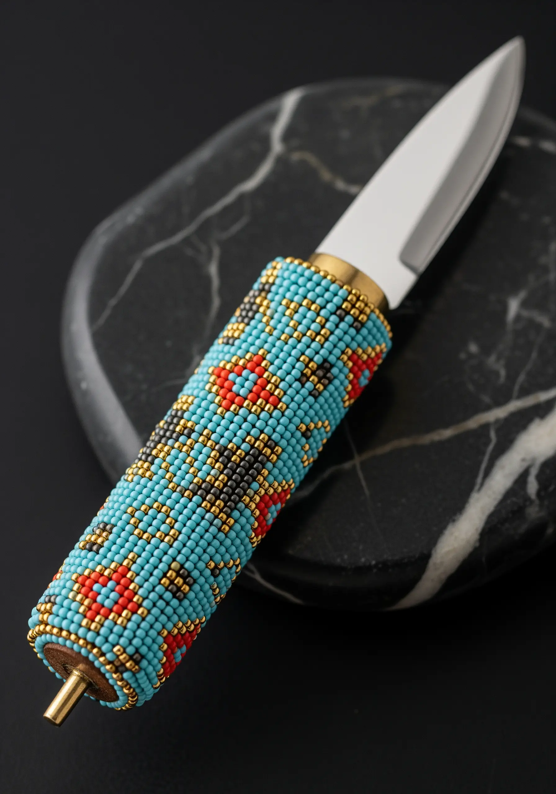 The handle of a knife covered in a tight, patterned layer of seed beads.
