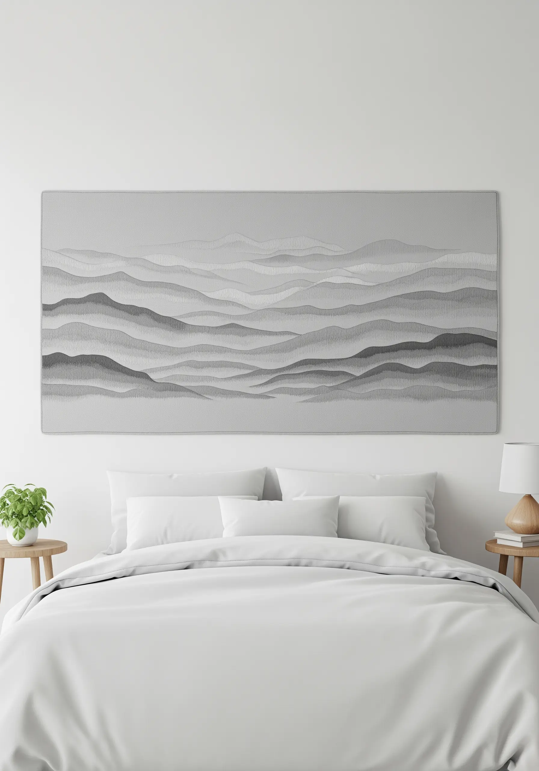 A long, panoramic embroidery of misty, rolling hills in shades of grey.