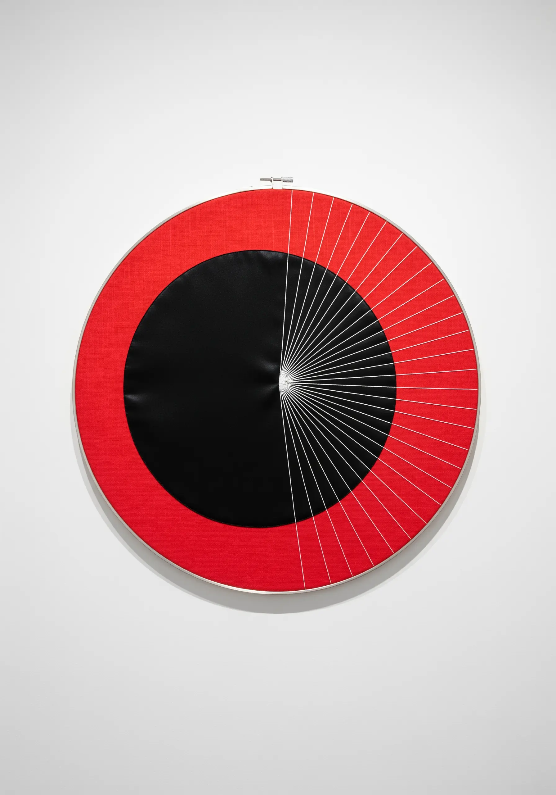 A high-contrast design with a red background, a black semi-circle, and radiating white lines.