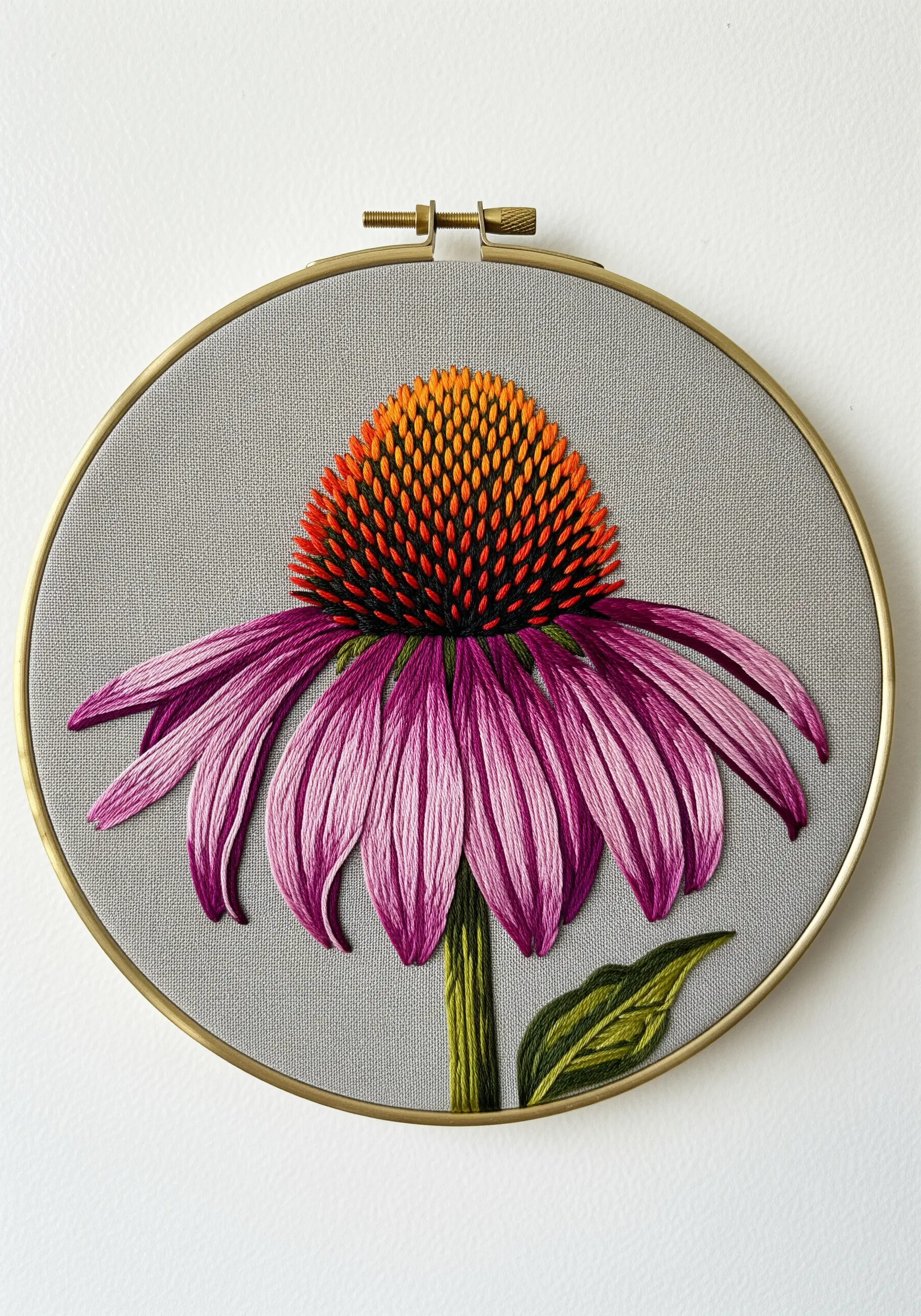 Detailed thread-painted echinacea flower with pink petals and a textured orange and brown cone.